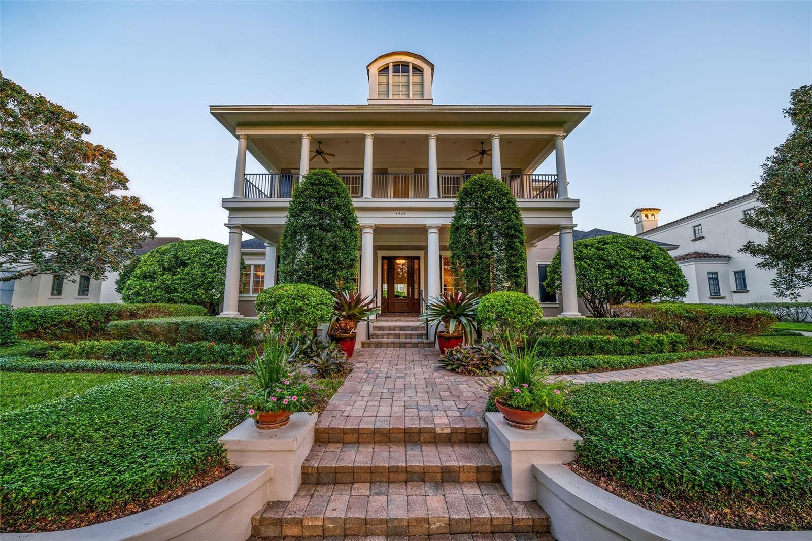 Discover this timeless 5,886 square foot home on sought-after New Broad Street in Baldwin Park. Perfectly blending space, privacy, and location, this 5 bedroom, 7 bathroom residence is a rare gem in one of Orlando's most desirable communities.
Step outside to enjoy Baldwin Park's charm, with tree-lined streets, vibrant parks, and a short walk to the village center’s dining, shopping, and entertainment. Enjoy scenic walking and biking trails, serene Lake Baldwin, and access to community pools, all just minutes away.
From the inviting front porch to the thoughtfully designed interiors, this home is ideal for both grand gatherings and quiet retreats. The spacious living areas flow effortlessly outdoors, where a summer kitchen, outdoor fireplace, and a sparkling pool and spa create a private oasis. Prefer a night in? Enjoy a movie in your impressively themed private theater for the ultimate cozy escape.
The heart of the home is the well-appointed kitchen, offering ample storage, functionality, and a seamless connection to the family room and dining spaces. The luxurious primary suite is a serene retreat with a spa-like bathroom, generous closets, and a sitting area overlooking the pool. Secondary bedrooms each feature ensuite baths, providing comfort and privacy for family and guests.
Additional highlights include a versatile gym with a wet bar, a private office, a 3 car garage, and abundant storage throughout, including professionally installed garage shelving and attic space.
Ideally located between downtown Orlando and Winter Park’s Park Avenue, this home offers top rated schools and an unmatched lifestyle. Schedule your showing today to experience this remarkable residence and all that Baldwin Park has to offer!