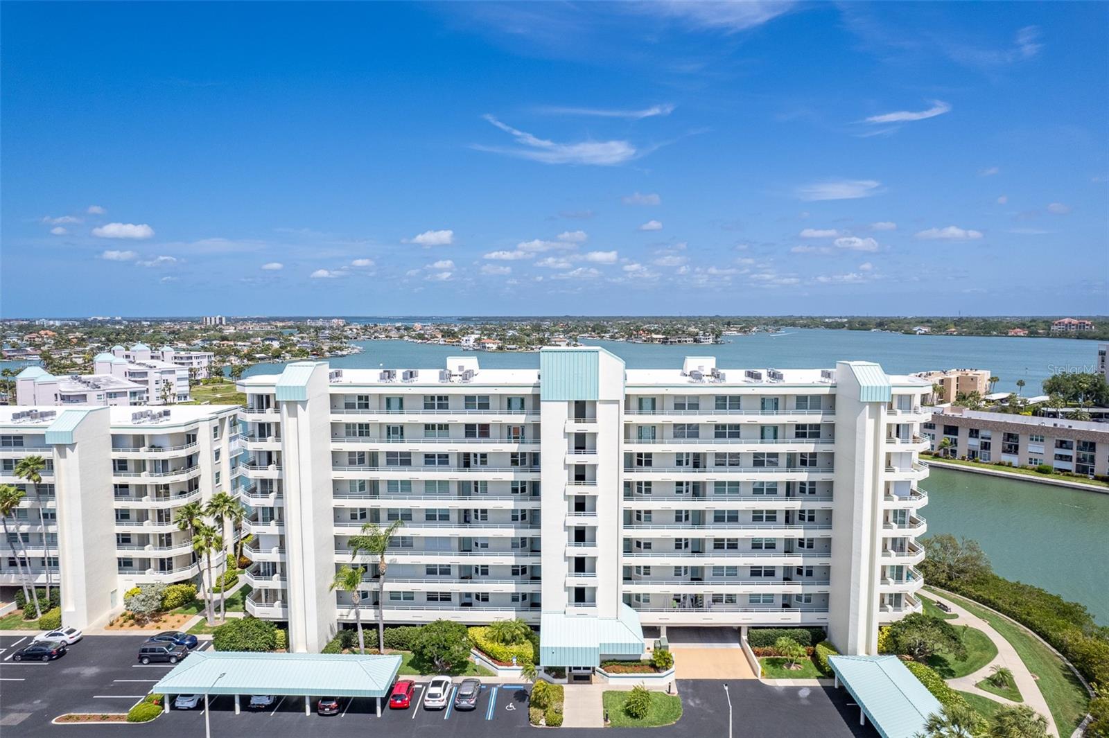 One or more photo(s) has been virtually staged. Welcome to Harbourside, where coastal luxury meets effortless living. This stunning penthouse corner residence offers two bedrooms, two baths and sweeping panoramic views that immediately set it apart from others. Lightly renovated in 2024, the home features luxury vinyl plank flooring, fresh interior paint, and tasteful updates that enhance its bright, coastal feel. Upon entering, you're welcomed by a versatile secondary living space alongside the kitchen, complete with its charming private balcony, the ideal spot for morning coffee or sunset breezes. As you continue through the home, the spacious dining and main living areas unfold into an impressive entertaining space framed by breathtaking views of the Intracoastal Waterway and the Gulf of Mexico from the expansive balcony and surrounding windows. Thoughtfully positioned for privacy and comfort, the primary suite and guest bedroom offer a functional layout ideal for everyday living and hosting visitors alike. The home is further complemented by two full baths and in-unit laundry for added convenience. Within the gated waterfront community of Harbourside in South Pasadena, residents enjoy resort-style amenities designed for an active coastal lifestyle, including a clubhouse, multiple pools, fitness center, pickleball courts, tennis courts, shuffleboard, grilling areas and more. A beautifully maintained 1.5-mile waterfront recreational trail adds to the community's appeal. Ideally just minutes from St. Pete Beach and approximately 20 minutes from the vibrant downtown St. Petersburg, this residence offers a wonderful balance of relaxation, recreation and accessibility. Experience the lifestyle Harbourside is known for. All unit interior photos have been virtually staged.