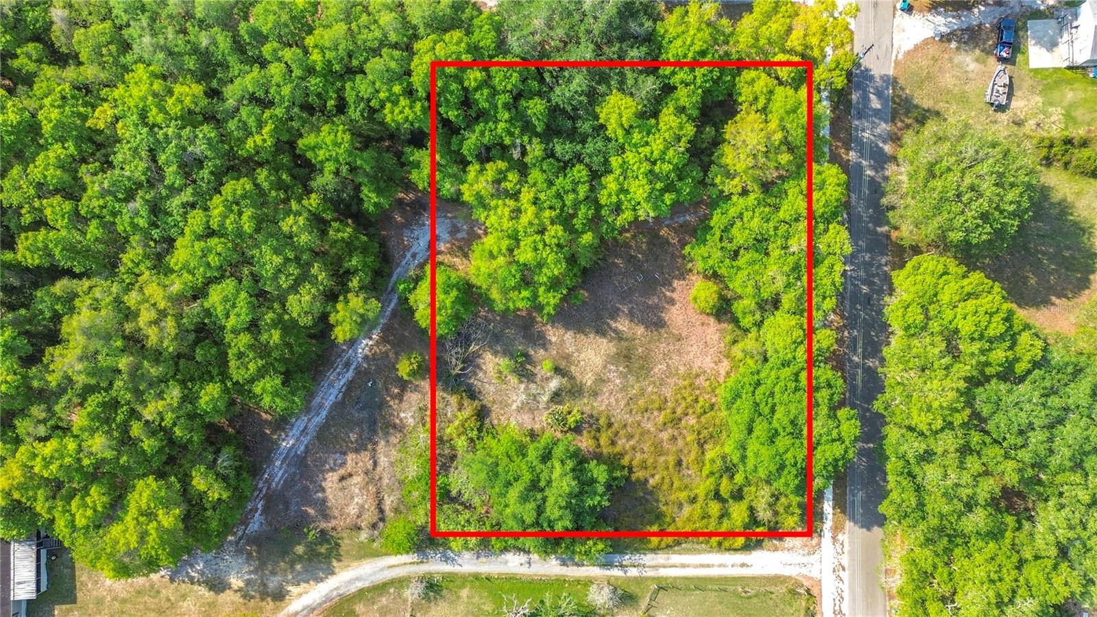 Prime 1-acre buildable lot located near the highly sought-after area of The Villages, offering excellent potential for homeowners and investors alike. Water, sewer, and electric are nearby, making future development more accessible. Permitted uses include single-family homes, manufactured homes, and mobile homes, providing multiple possibilities for personal use, rental, or resale. With the proper permit, you may also reside on the property in an RV while building, adding flexibility during construction. 

The property sits on a paved road in a residential area with neighboring homes and convenient access to U.S. Highway 301, grocery stores, and everyday essentials. It is just minutes from popular local destinations such as Gazebo at Summer Lake Landing and Lake Okahumpka Park, enhancing the appeal of the location.

No flood zone, no HOA, and no wetlands, giving buyers greater flexibility for development and long-term value.
When developing this property, you are required to contact the city of Wildwood to complete annexation into the city, as the property will be connected to City utilities. Buyer to verify all information and permitted uses with the county.