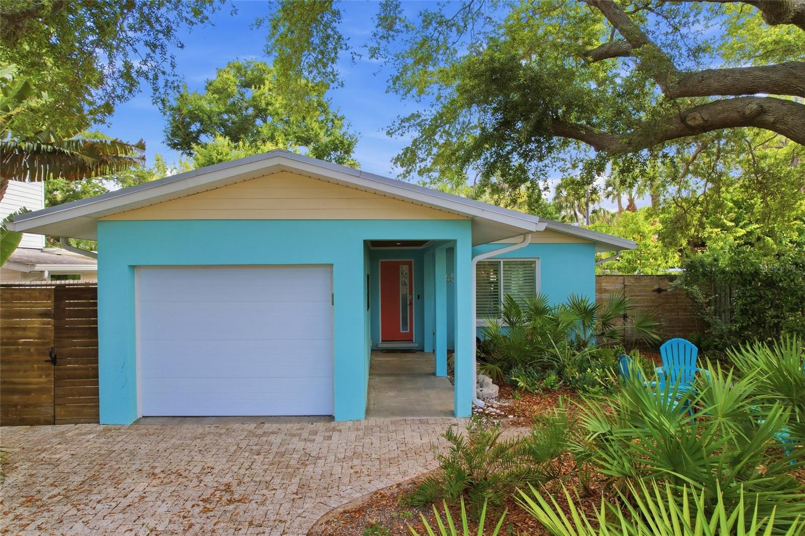 Recently renovated mid-century cottage just west of Tamiami Trail in the coveted Indian Beach Sapphire Shores neighborhood. This 2-bedroom, 1.5-bath home features terrazzo floors, shiplap ceilings, and warm wood accents, with mature tropical landscaping framing the home. The renovated kitchen pairs white shaker cabinets, butcher block counters, and stainless steel appliances with a sunlit breakfast nook that flows into the dining area. Plantation shutters throughout. Ready to move in as a seasonal retreat, short-term rental or primary residence. Blocks to Indian Beach, minutes to downtown Sarasota, the Ringling Museum, and St. Armands Circle. A rare mid-century gem in one of Sarasota's most-loved neighborhoods.