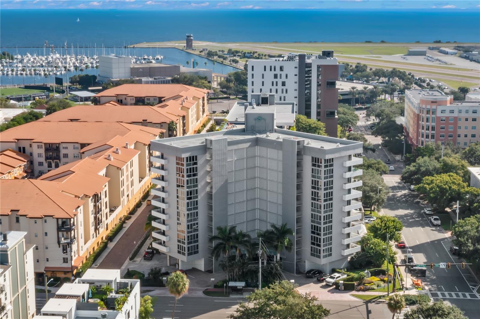 In the heart of Downtown St. Petersburg, where vibrant city streets meet the sparkling waterfront, you'll find the iconic and historic Beacon on 3rd. Once the tallest building in the city, The Beacon now stands among a striking skyline, offering residents the perfect blend of history, character, and an unbeatable location. Situated on the fifth floor, this bright and welcoming studio is framed by floor-to-ceiling windows that span the entire living space, filling the home with natural light while overlooking lush greenery and partial views of beautiful Tampa Bay. Tile flooring extends throughout the residence, creating a clean, low-maintenance interior. The spacious kitchen features crisp white cabinetry and a convenient breakfast bar, while the in-unit washer and dryer combination adds everyday convenience. The bathroom offers generous shelving and storage, maximizing functionality without sacrificing style. Life at The Beacon is all about enjoying downtown living to its fullest. Residents have access to a rooftop terrace, resort-style pool with cabanas and grilling stations, 24-hour fitness center, secured entry, evening and weekend security, as well as designated and guest parking. Even more, the HOA includes the cost of heating and air conditioning while allowing you to maintain your own climate control. Step outside and enjoy one of Florida's most walkable downtowns, with award-winning restaurants, lively cafés, waterfront parks, world-class museums, theaters, and endless entertainment just moments from your door. Take advantage of this opportunity to own a piece of Downtown St. Petersburg at an exceptional value.