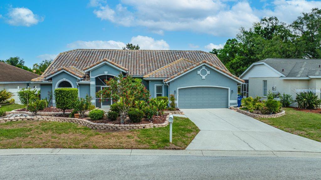 This well maintained home in the West Palm community is truly one not to miss!  Everything you've been looking for is here; offering many updates with luxury touches.  The home offers a three bedroom split plan, with an open flow and ample space for entertaining, and enjoying family life. The primary bedroom and bath are an oasis for comfort and relaxation and the walk-in closet offers impressive space. One of the upgrades includes the gorgeous Pebble Tec finished pool and paved decking, which is sure to please those loving the out of doors.  The home includes special touches such as; upgraded windows, vaulted ceilings, custom window coverings, plantation shutters, updated flooring, recent exterior paint and so much more!  Buyers will be "wowed" by the features offered in the oversized garage; with it's finished flooring, generous cabinetry and an additional area for storage. The HOA fee is a reasonable $500 per year.  Put this one on your list to see today!