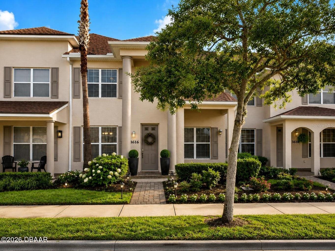 This beautifully maintained, move-in ready two-story townhome offers 3 bedrooms, 2.5 bathrooms, and a spacious 2-car garage. Filled with natural light, the open-concept floor plan is perfect for both everyday living and entertaining. The kitchen features solid surface countertops, abundant cabinetry, and a breakfast bar with additional seating. Upstairs, you'll find two generously sized bedrooms, each with a walk-in closet and private en-suite bathroom featuring floor-to-ceiling tiled showers and solid surface vanities.  Residents enjoy access to a community pool, park, and more than 21 miles of scenic walking and biking trails throughout Venetian Bay. Ideally located near shopping, dining, golf, medical facilities, and everyday conveniences, with easy access to I-95 and just a short drive to the area's beautiful beaches. This is low-maintenance Florida living at its finest!
