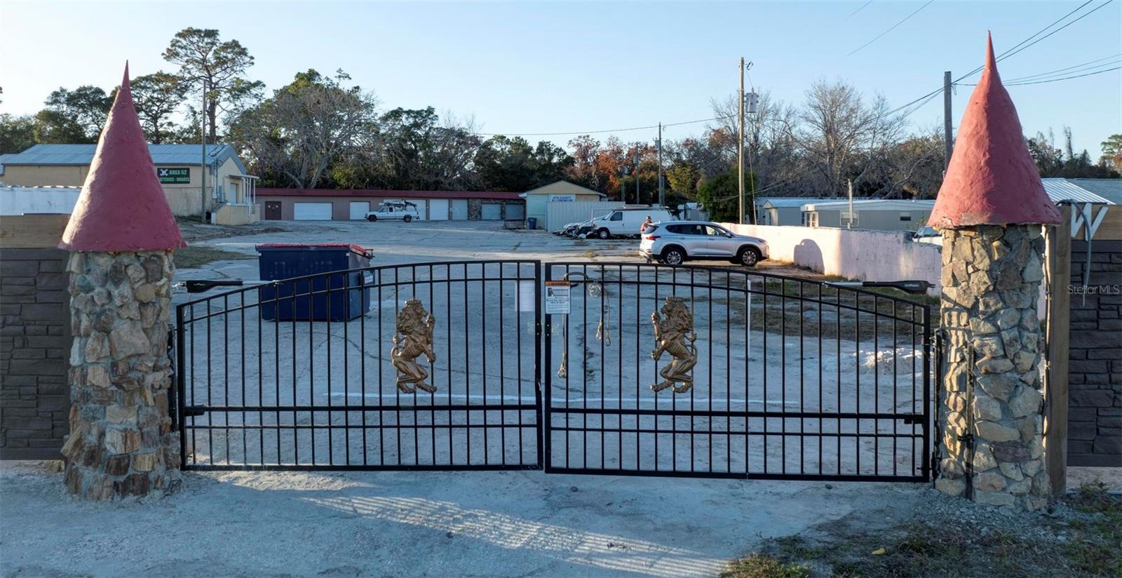 BUSINESS OPPORTUNITY KNOCKS!!! Zoned C-2 on Commercial Way , N. Hudson, FL. on 1 -1/2 acres is this amazing rental income producing gated property. Individual garages can be used for storage, auto-detailing shop, office rentals or many other usage. Very reasonable way to store your valuables in these shipping containers in a secure and safe location. Enough lot space for possible used car sales..... or any other type of business. Come discover this business opportunity.  Motivated seller.
