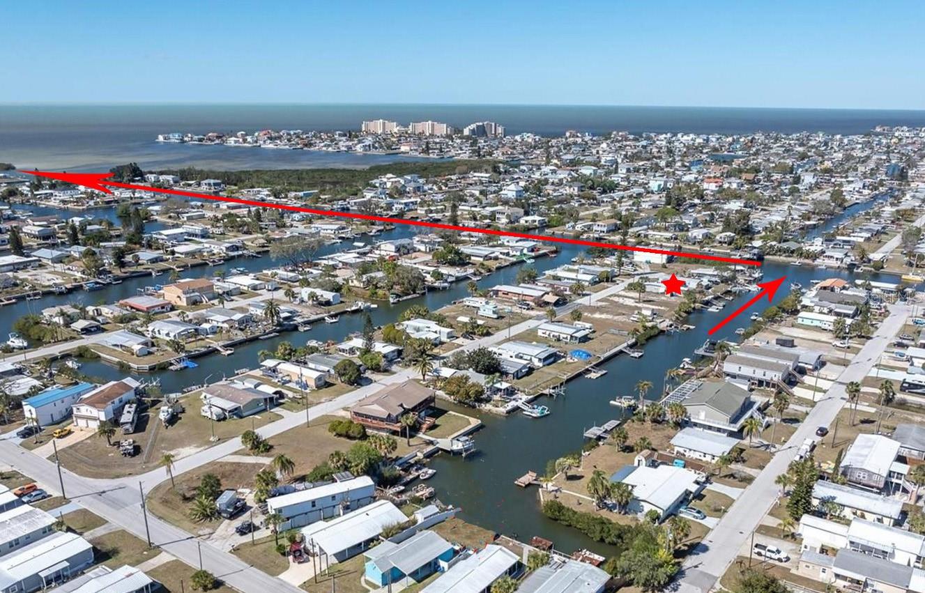 Direct Gulf access! This waterfront homesite offers 40 feet of frontage on a saltwater canal and includes a floating dock plus a concrete seawall installed in 2023 at an approximate cost of $20,000. Enjoy quick access to the Gulf of America with no fixed bridges, making it ideal for boating, fishing, and the Florida waterfront lifestyle. Located in the Signal Cove community, owners have the option to join the Civic Association, which offers a clubhouse and access to a private boat ramp. Optional membership is $65 per year, with an additional $40 annually for boat ramp access. Conveniently located near major highways, medical facilities, shopping, dining, and Gulf beaches. Value is in the land. The existing mobile home is uninhabitable due to flooding and substantial damage from the 2024 hurricanes. Buyer to determine rehab or demolition. Cash only.