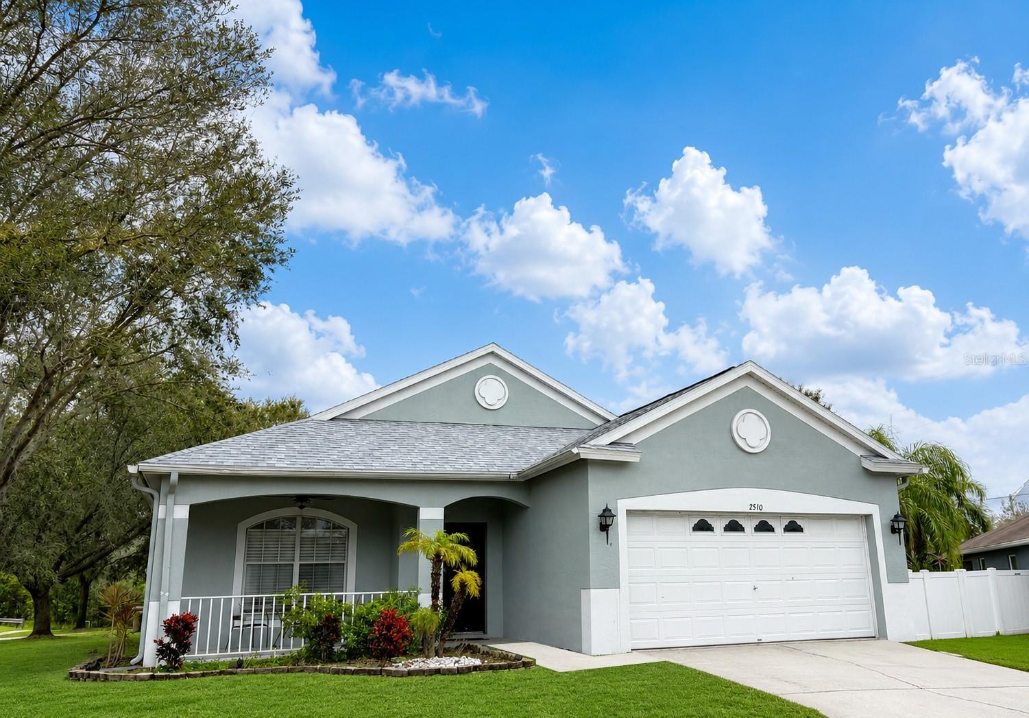 Located in Suncoast Meadows community of Land O' Lakes, this beautifully maintained home features a NEW ROOF (2025), NEW A/C (2026), laminate and tile flooring throughout with NO carpet, and an oversized two-car garage. Situated on a spacious white vinyl-fenced corner lot just shy of a quarter acre (.22 acres), the property offers abundant natural light and inviting indoor-outdoor spaces perfect for both relaxing and entertaining.

The spacious kitchen offers ample cabinetry and storage, while the open living area creates an ideal layout for everyday living. Large windows fill the home with natural light, enhancing its bright and welcoming atmosphere. Crown molding throughout and decorative wainscoting add architectural charm and character.

Enjoy an incredibly convenient location just minutes from the Veterans Expressway, shopping, restaurants, and top-rated schools.