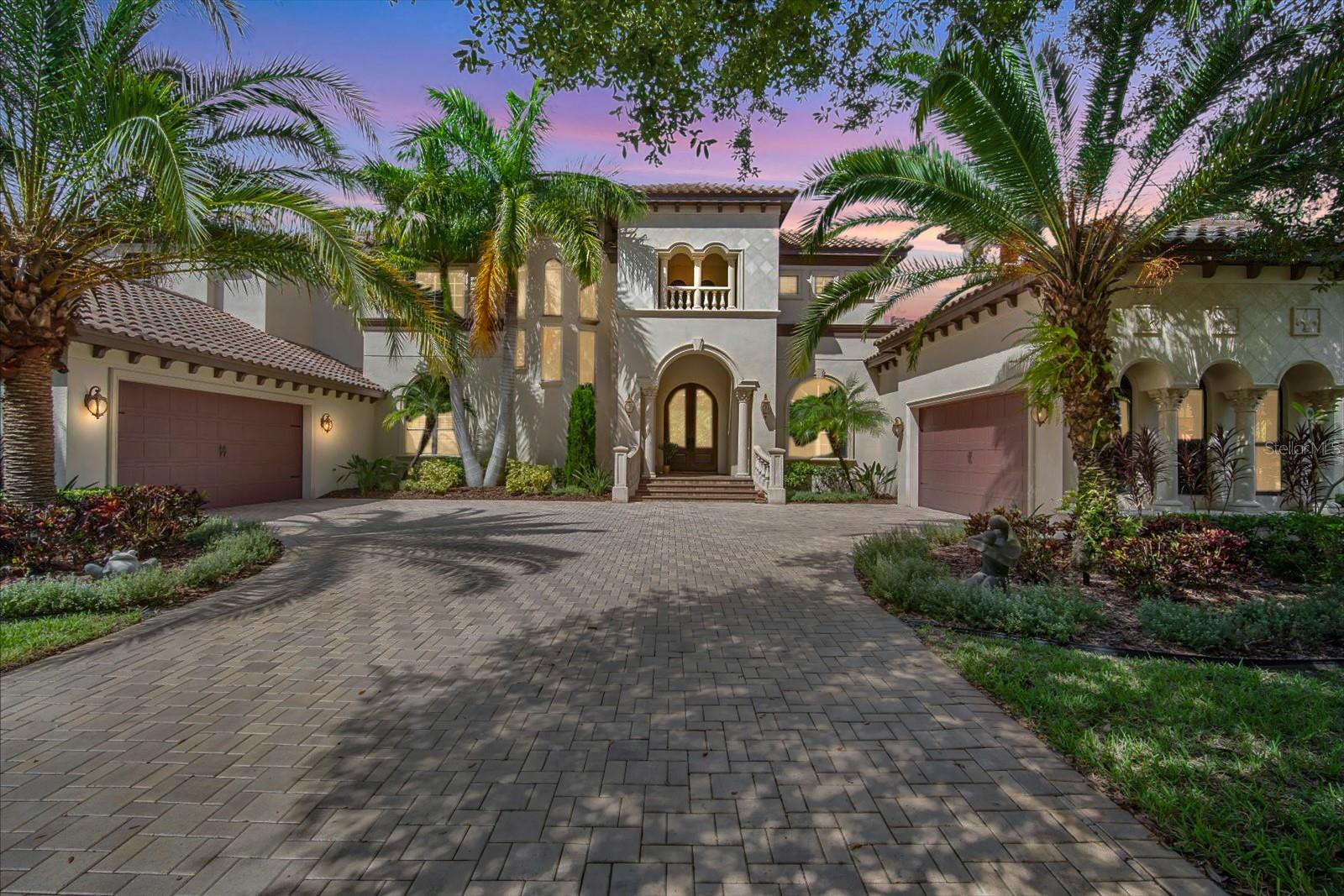 Entertainer's Paradise with your own resort style pool and spa. Custom Homes by John C. Fowke Inc with 6 bedrooms, office, bonus loft, secret room and an incredible outdoor space. Flexible Floor Plan depending on how many bedrooms needed.  Prepare to be captivated by this one-of-a-kind, elegant estate, designed for those who love to host. Oversized .64-acre tropical lot in the highly sought-after gated section of Ternwood in FishHawk Ranch.  Enter through the grand entry, the custom craftsmanship is evident, showcased by 24-foot soaring ceilings, 8-foot doors, and custom details throughout. The formal dining room with expansive windows and leads to a custom wine cellar, featuring built-in barrels to a style to your wine collection. The living room, is a showcase of architectural brilliance, boasting a gas fireplace and an awe-inspiring commercial-grade, two-story glass wall that seamlessly frames the breathtaking outdoor oasis.
The gourmet kitchen is designed for both the casual family meal and grand catering events. Thermador professional-grade appliances, granite countertops, an island with sink, and a gas stove. A large pantry for organized storage. Spacious family room features double, connected sliding glass doors that fully retract, connecting indoor and outdoor living. 
Step outside to discover your private, resort-style paradise! The sprawling outdoor space features gorgeous travertine floors, multiple defined outdoor living areas, and an outdoor kitchen and gas fireplace sitting area. The custom, zero-entry pool is a true spectacle, complete with a sunken bar with seating, cascading waterfalls, a fun slide, and five captivating fire bowls for dramatic evening ambiance. This space is not just a backyard; it’s a year-round vacation destination.
This 5-bedroom estate is meticulously laid out for both privacy and function. The extraordinary Primary Suite occupies the right side of the first floor, offering an oversized bedroom with tray ceilings, a dedicated seating area, and three custom walk-in closets. The custom primary bath provides tons of space, a jetted garden tub, dual vanities, and a unique, centrally-shaped walk-in shower with a bench and multiple showerheads.
Downstairs also features: A guest bedroom connected to a full bath and a sprawling bonus room that is perfect for an ultimate game room or an in-law suite with direct lanai access. A massive custom-designed home office, complete with an elegant spiral staircase leading to a secret room—perfect as a private reading nook, hobby area, or secure storage. An additional flexible space, currently used as a gym, that could easily function as a sixth bedroom or second-floor living area. The second floor is equally impressive, hosting a large loft area that opens up to an extended balcony with serene views of the tropical landscaping and pool. Three additional upstairs bedrooms. The home is climate-controlled by four separate A/C zones, ensuring comfort year-round. Live in one of Lithia’s most desirable communities, FishHawk Ranch, renowned for its beautiful setting, endless resort-style amenities, miles of nature trails, and A-rated school district. This is more than a home; it’s the lifestyle you’ve been dreaming of. A truly custom, well-crafted sanctuary for family, entertaining, and enjoying the Florida life. Don’t just read about it—come see for yourself.  This is a home where vaulted ceilings echo with laughter, where the pool is a stage for memories to be created.