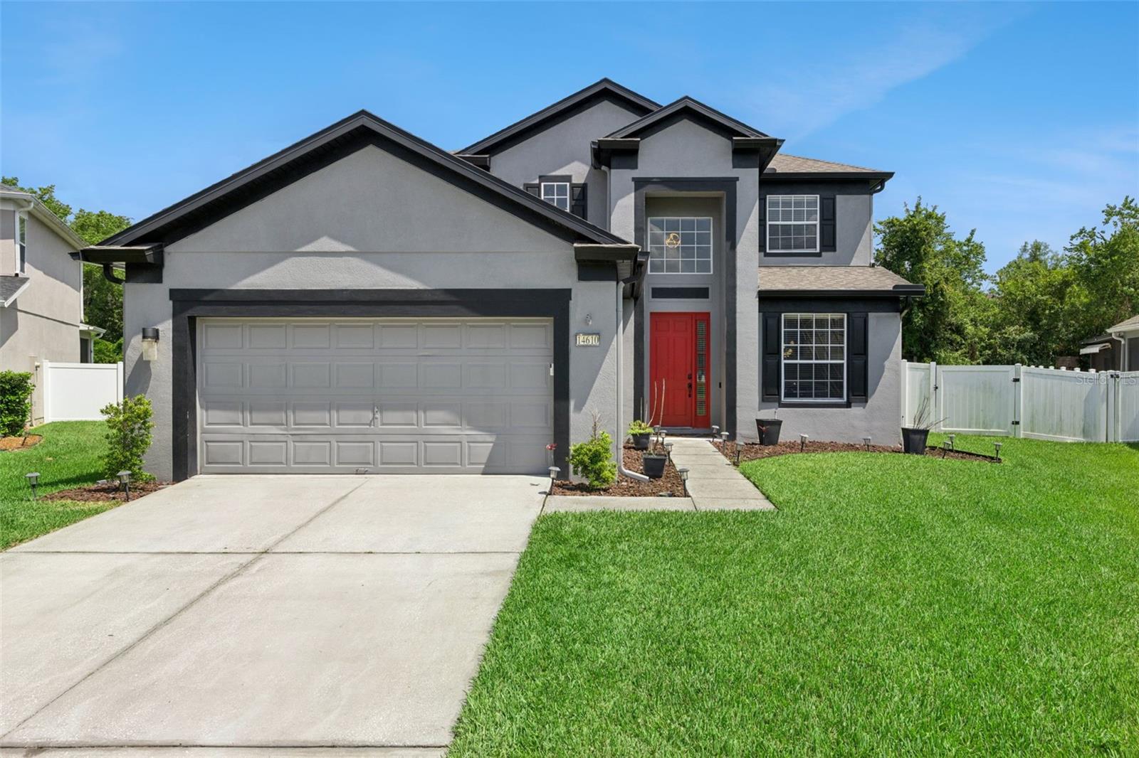 Located within the highly sought-after 24-hour guard-gated community of Spring Isle in the heart of Avalon Park, this beautifully updated home combines modern upgrades, spacious living, and one of East Orlando's most desirable locations! Situated on a quarter acre lot, you'll enjoy a low-maintenance lifestyle with resort-style amenities including a community pool, fitness center, playground, dog park, and 24-hour guarded entrance.

Upon entry, you're greeted by soaring ceilings in the foyer, abundant natural light, and an open-concept floor plan that creates an inviting space for everyday living and entertaining. The spacious first-floor primary suite offers the convenience of single-level living while creating a peaceful retreat separate from the additional bedrooms upstairs. Recent updates include luxury vinyl plank flooring, brand-new carpet upstairs in the living areas, refinished kitchen cabinets, new kitchen appliances, roof replacement in 2019, new HVAC systems (Downstairs - 2026 & Upstairs - 2022), fresh exterior paint, and a screened lanai overlooking a fully vinyl & brick fenced backyard.

Just minutes from Downtown Avalon Park, you'll enjoy charming restaurants, coffee shops, boutiques, breweries, farmers markets, and year-round community events that give the area its signature small-town charm. Conveniently located near Waterford Lakes Town Center, UCF, Research Park, SR-408, SR-417, Orlando International Airport, Lake Nona Medical City, and Downtown Orlando, this home provides easy access to shopping, dining, major employers, and everything that makes East Orlando one of Central Florida's most desirable places to live.

If you've been searching for an updated home on an oversized lot in one of East Orlando's premier guard-gated communities, 14610 Windigo Lane is where comfort, convenience, and community come together.