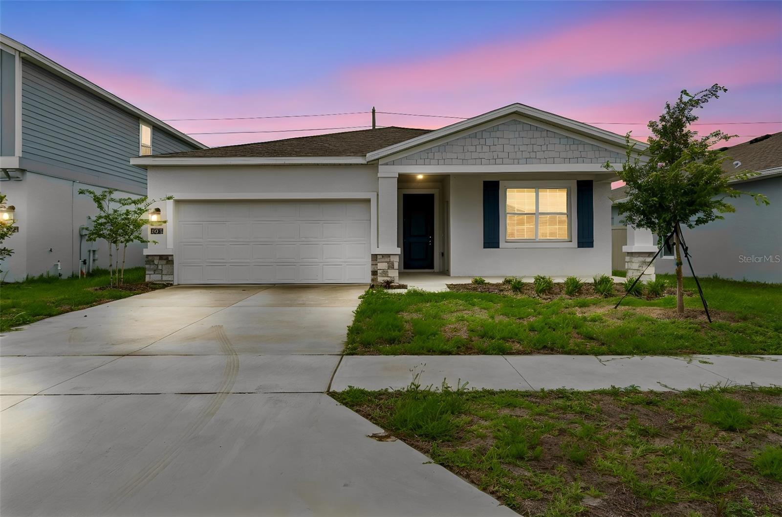 One or more photo(s) has been virtually staged. Welcome to Peace Creek Reserve! Built in 2024, this move-in ready home offers the benefits of newer construction without the wait.

Featuring 4 bedrooms, 3 full bathrooms, and a private in-law suite complete with its own kitchen and full bath, this flexible floor plan is ideal for multigenerational living, extended family, guests, or a private home office setup.

The spacious main kitchen serves as the heart of the home, showcasing a center island with sink, abundant cabinetry, and an open-concept design that flows seamlessly into the living areas. Tile flooring extends throughout the main living spaces, while the bedrooms provide the comfort of carpeting.

The primary suite offers a generous bedroom, walk-in closet, and private bath with dual vanities. Three additional bedrooms and two full baths provide plenty of room for family and guests.

Step outside to the covered rear lanai and backyard, perfect for relaxing or entertaining. Conveniently located in Peace Creek Reserve, residents enjoy onsite pool and playground as well as easy access to shopping, dining, medical facilities, schools, and major commuter routes.

Why wait months for new construction when you can move into this nearly new home today?
