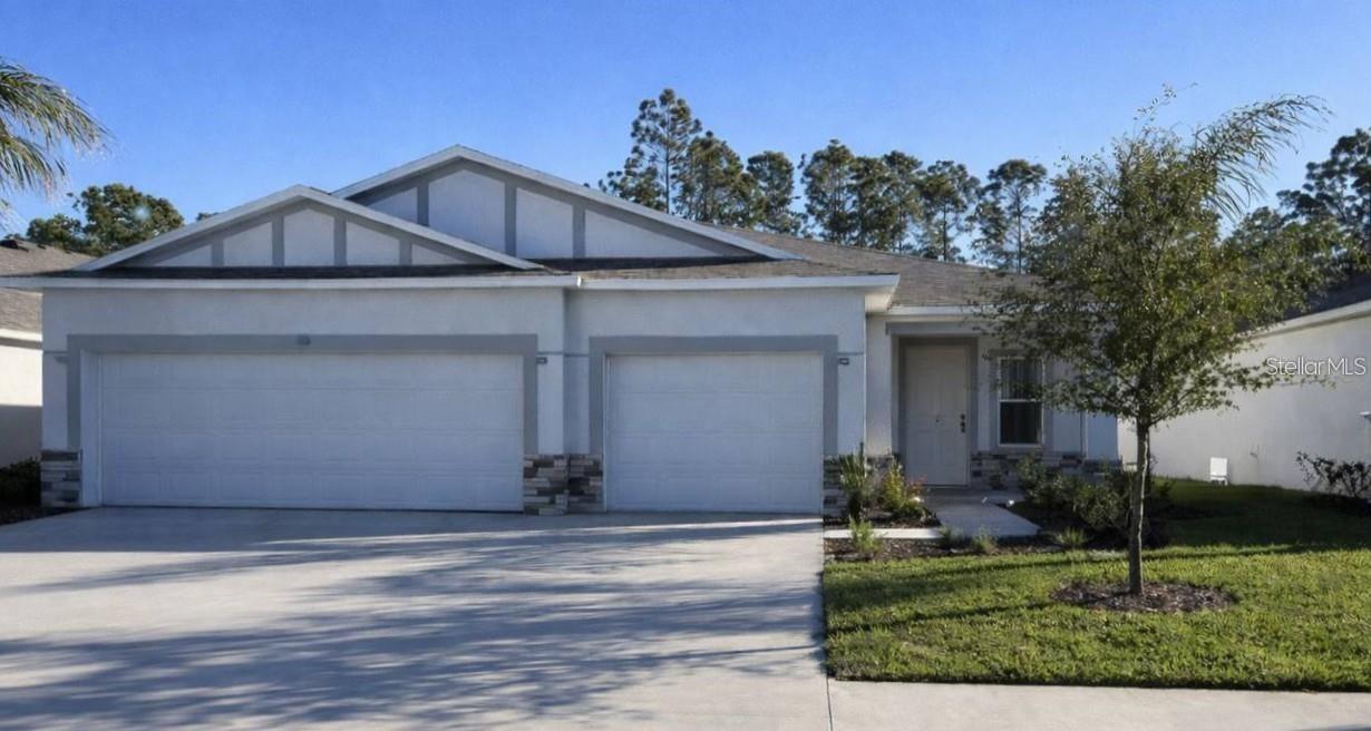 Pre-Construction. To be built. Along the scenic shores of the Indian River, the Ashton in Edgewater captures the essence of relaxed coastal living with refined finishes and a thoughtfully designed layout. Set on a beautiful centrally located homesite, the stone accented front elevation, architectural shingles, professional landscaping, irrigation system, hurricane shutters, and oversized three car garage create standout curb appeal with lasting value. Inside, 8’8” ceilings, wood-look ceramic tile flooring enhances all main living areas, while plush carpet brings comfort to the bedrooms. Just off the foyer, a versatile flex space provides the perfect setting for a home office, fitness room, or private lounge, adapting beautifully to your needs. 
The open Great Room is filled with natural light from an additional window and highlighted by six LED flush mount lights, creating a bright and welcoming gathering space. The kitchen serves as the centerpiece, featuring a large island, granite countertops, and a spacious pantry, all flowing seamlessly into the living area. Sliding glass doors open to the lanai, extending your living space outdoors for effortless Florida living. Privately tucked away, the primary suite provides a peaceful retreat with an upgraded tile shower with glass enclosure, granite countertops, and dual sinks, creating a spa inspired experience. Secondary bedrooms are comfortably positioned nearby, while the centrally located laundry room provides everyday convenience and direct access to the oversized three car garage, ideal for storage, hobbies, and recreational equipment. Modern efficiency meets peace of mind with the built in Smart Home Package, including a Ring Video Doorbell, Smart Thermostat, Keyless Entry Smart Door Lock, and Deako Switches. Embrace the rhythm of coastal living, where river breezes, sandy shores, and glowing sunsets are no longer a getaway but your everyday reality. Schedule your private tour and start living the Florida lifestyle you’ve been dreaming about.