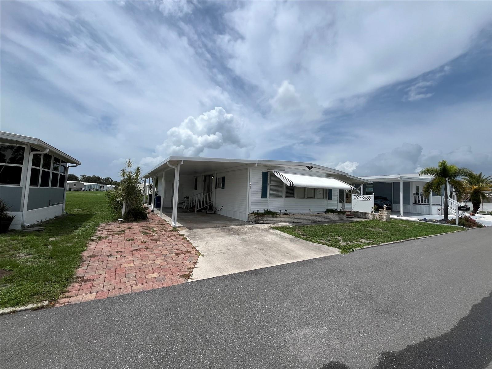 WOW what a price point. Starting on the exterior you have side by side parking with a new carport and shed, a large rear green space , vinyl siding, New AC in 2025, Newer membrane roof over, New electric pedestal, Hot water heater in 2024, Inside boasts 9 closets with 2 in each bedroom, Laminate flooring for the front section of the home and bedrooms with carpet. This very large home is fully furnished with everything you need to move right in.
Venice Isle is the premier resident owned over 55 Mobile home Park in Venice. There are close to 1000 homes with the most active residents. There is always something going on for you to do. We have many Park gatherings and first rate shows on site. The Park has every amenity you can imagine. Come take a walk through both of our 2 clubhouses and make yourself at home. The Park has 2 tennis courts, a fitness center, 2 heated pools, 2 hot tubs, saunas, putting greens, shuffleboard, Bocce ball, miniature golf, art rooms, pool room, TV lounges, card rooms, library, horseshoes, ceramic kilns, 2 huge ballrooms, Sunday services and much more!