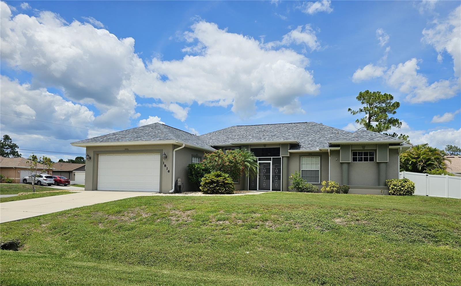 PRICE REDUCTION!  Discover comfortable Florida living in this well-maintained, 4 bedroom, 2.5 bath home located in a peaceful North Port neighborhood.  NOT A FLOOD ZONE!  The property features an inviting open layout with bright living areas that flows easily into the dining space and kitchen, creating a functional setup for everyday living.  The kitchen features slow close wood cabinets, granite countertops, stainless steel appliances, breakfast bar and nook.  Two living areas include a large living room with triple tray ceiling and glass pocket sliders, the den with glass sliders that both lead to the lanai and pool area.  The split-bedroom design provides privacy, with a spacious primary suite offering walk-in closets and an en-suite bath with two sinks, and jetted soaking tub.  Tray ceiling in the primary bedroom with glass sliders leading to the pool area.  The additional bedrooms are well-sized and versatile for guests, or furniture enhancements.  Heated saltwater pool and hot tub, wet bar, storage, and a half bath.  NEW ROOF and Insulation 2022.   New tile throughout all living areas. New hot water heater.  Conveniently situated near shopping, dining, parks, and Gulf Coast Beaches.  The home delivers a balanced blend of comfort, convenience, and value in a growing community.
