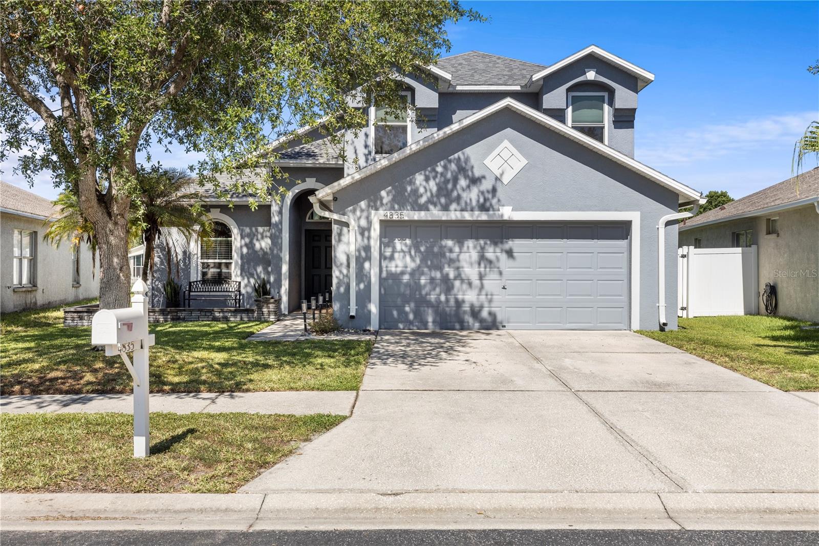 Step inside this beautifully maintained 3-bedroom, 2.5-bathroom home offering 1,791 square feet of comfortable living space designed for both everyday living and entertaining. The open and inviting floor plan features luxury vinyl plank flooring throughout the main living areas, updated kitchen appliances, abundant natural light, and a seamless flow to the screened lanai and paver patio, creating the perfect indoor-outdoor living experience. Upstairs, you'll find spacious bedrooms with newer carpet, while major system updates provide peace of mind, including a new roof (2019), hurricane-impact windows and sliding glass doors, a Halo 5 whole-house water filtration system, LeafFilter gutter protection, a tankless water heater, and a brand-new air conditioning system installed in 2025 with a transferable 12-year warranty. Located in the highly desirable Grand Oaks community of Land O' Lakes, residents enjoy convenient access to community amenities while being just minutes from the Tampa Premium Outlets, The Shops at Wiregrass, Costco, AdventHealth Wesley Chapel, top-rated schools, restaurants, entertainment, and major commuter routes including I-75 and SR 54. Buyers searching for a move-in-ready home with a new roof, new AC, impact windows, screened lanai, paver patio, upgraded flooring, updated appliances, energy-efficient features, and a prime location near Wesley Chapel shopping and dining will not want to miss this opportunity.