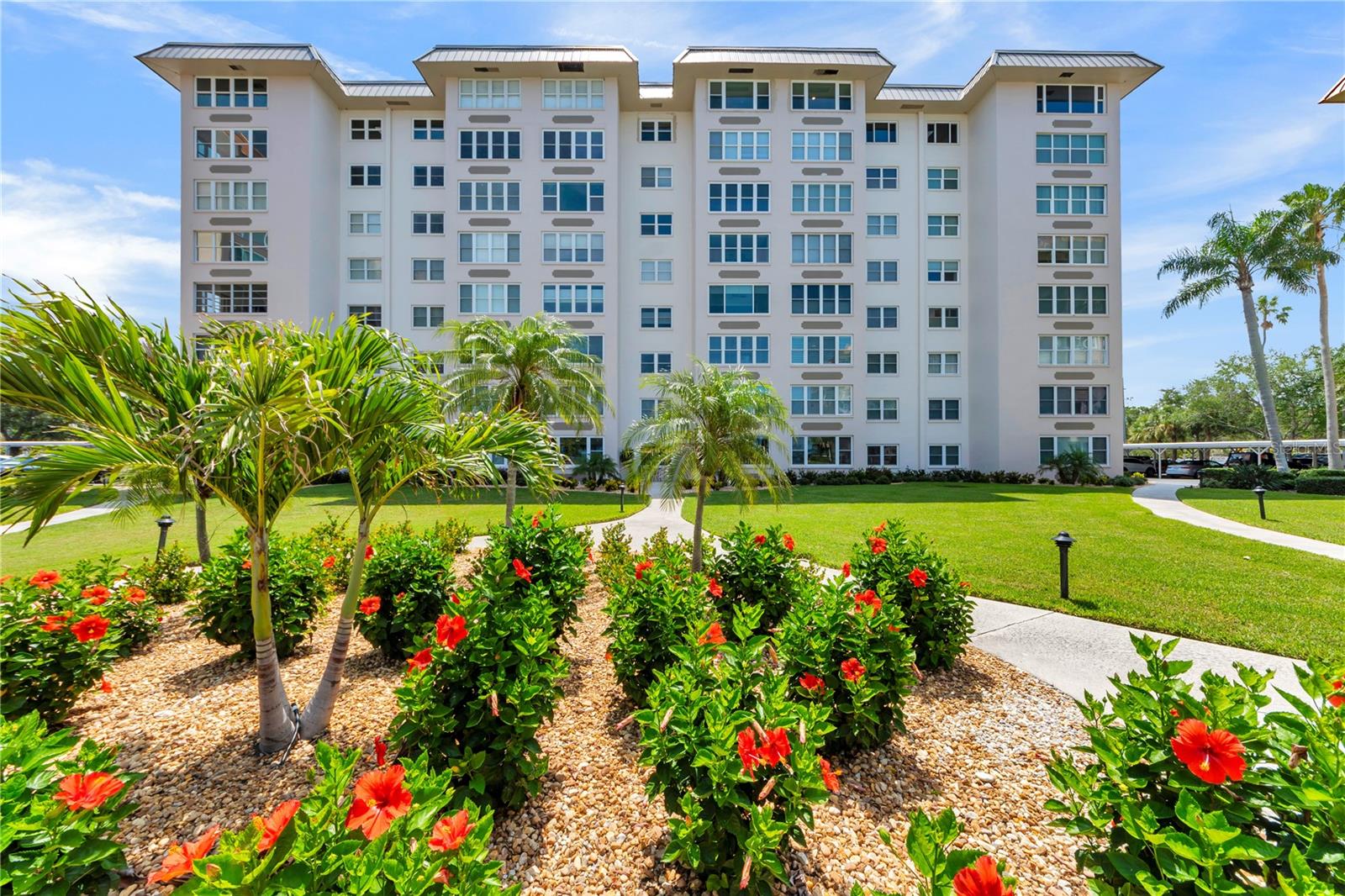 Stunning top floor panoramic waterfront and sunset views in the heart of downtown Dunedin! This 3 BR/2 BA, 2030 sqft condo will wow you with its large living/dining great room. Split bedroom floor plan offers privacy and comfort for guests. The huge primary suite also has gorgeous water views. You will find tons of closet space and large custom built-ins. Laundry and private storage located directly across the hall. Carport, bike and kayak storage. The newly decorated lobby is a great gathering spot. Large waterfront heated pool with spa jets, parklike oasis with picnic facilities, two fishing piers, large clubhouse on the water includes banquet hall, kitchen, fitness center, ping pong, pool table, and poker. An active rec committee hosts weekly activities and special events for this 55+ community. This is a unique opportunity steps from charming Dunedin restaurants, shops, the Pinellas Trail, and the TD Ballpark.