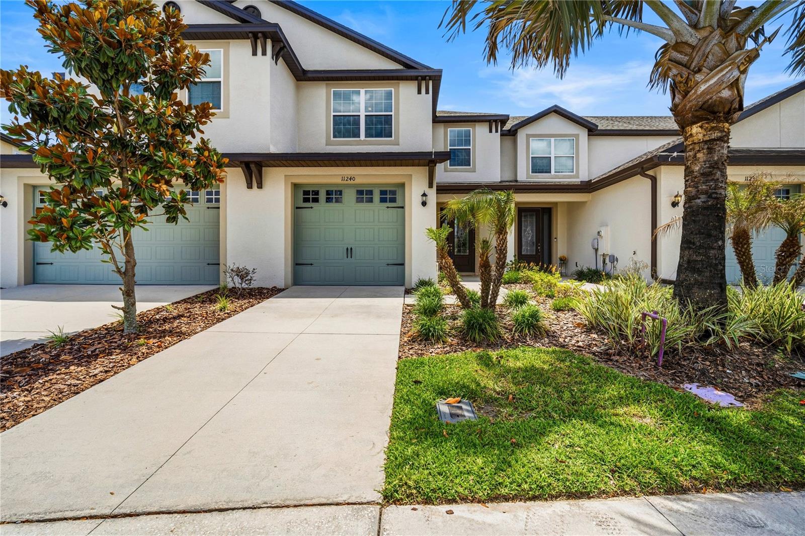 Perfect Premium Pond lot with water and conservation views awaits YOU!  Better than new, Located in the highly sought-after Lagoon community of Mirada, this beautifully designed Sorrento model townhome by LGI Homes offers low-maintenance living with resort-style amenities in one of the fastest-growing areas of San Antonio, Florida!  Boasting 1,856 square feet, this spacious 3-bedroom, 2.5-bath home features a light-filled OPEN floorplan with upscale finishes throughout, including laminate floors, quartz countertops & center island, tile backsplash and a stunning leaded glass entry door that creates a warm welcome from the moment you arrive.  The expansive living, dining and kitchen areas create the ideal space for entertaining guests or enjoying cozy nights at home, all while taking advantage of INCLUDED cable (2 boxes), WIFI (1 gig) and internet services.  Situated on a pond and conservation lot with no rear neighbors, the screened lanai provides peaceful water and woodland views, offering exceptional privacy and tranquility.  Upstairs, the spacious owner’s suite serves as a relaxing retreat with beautiful pond and conservation views, a walk-in closet, and a private ensuite bath accented with a decorative glass listello band. This home offers a split style bedroom setup, with full guest bath adorned with custom hardware and upgraded lighting, making it ideal for guests or multi-generational living. Additional highlights include a convenient upstairs laundry room with washer and dryer, a downstairs stylish half bath with pedestal sink, and most importantly maintenance-free living with the ability to lock and leave as a second vacation home, or live year round and add a fence, if desired. Living in Mirada means enjoying unlimited resident access to the spectacular 15-acre crystal lagoon, complete with sandy beaches, water activities, and year-round resort-style fun, plus 25 guest passes annually and access to nearby Epperson Lagoon. Ideally located with quick access to major highways and I-75, you’ll be just minutes from Pasco schools, colleges, Kirkland Ranch Academy of Innovation, Tampa Premium Outlets, medical facilities like BayCare and Advent Health Wesley Chapel, Publix Supermarket, Starbucks, shopping, dining and everything that makes this vibrant area such an incredible place to call home.  CALL TODAY!