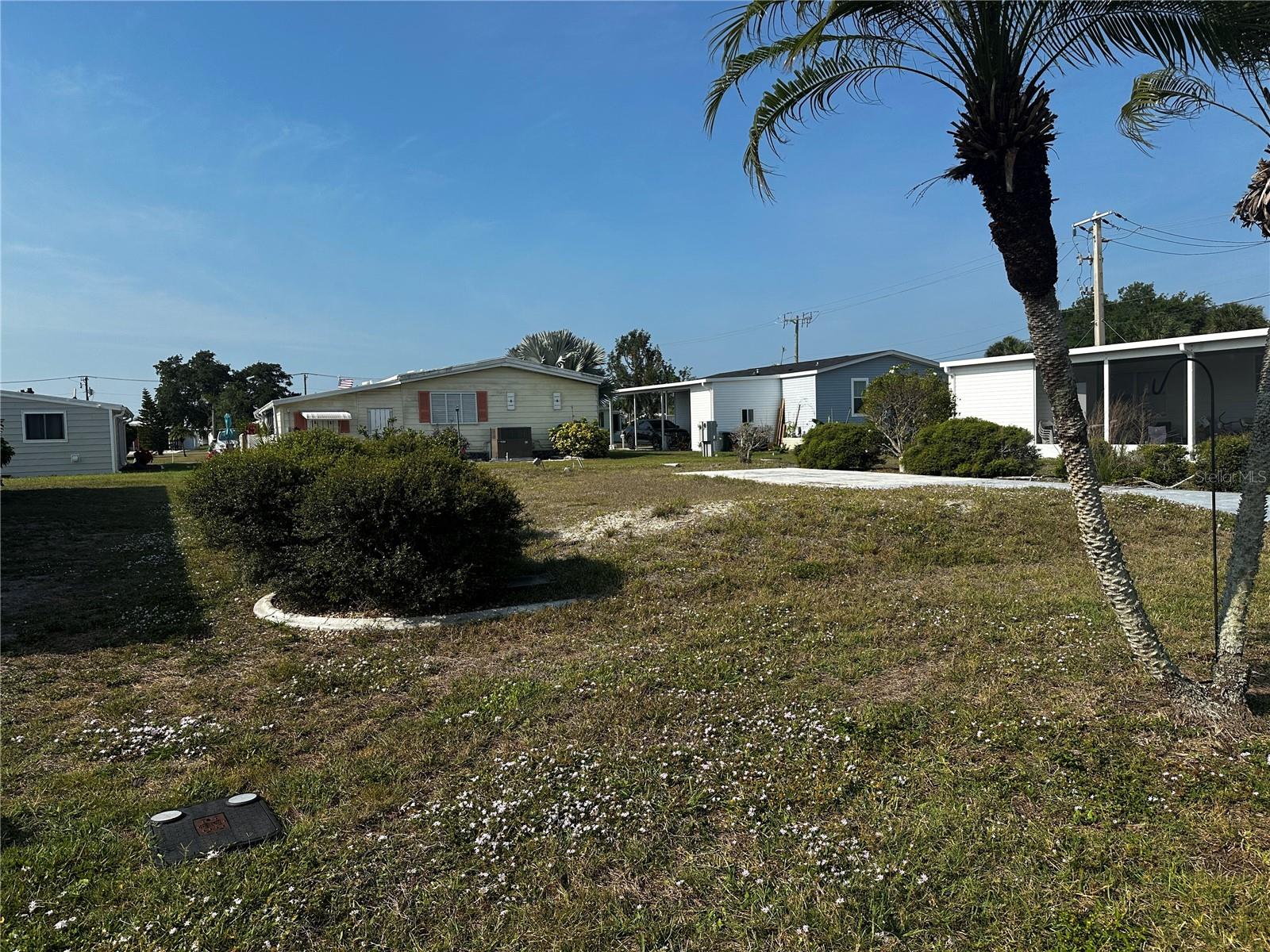 Rare opportunity in the highly sought-after 55+ Harbor Isles community in North Port! This surveyed building lot is the only one currently available, making it a truly unique chance to build your ideal Florida home in a premier, amenity-rich neighborhood. The lot is ready to go with an existing driveway already in place, saving you time and expense as you begin your plans. Building packages available, offering a streamlined path from purchase to completion. Harbor Isles offers a vibrant, resort-style lifestyle with two heated pools, marina with boat slips, kayak/canoe launch, fitness center, tennis, pickleball, and an active social calendar. Conveniently located near shopping, dining, I-75, and the Gulf beaches. Don’t miss your chance to secure one of the last remaining opportunities to build in this desirable, land-owned community!
