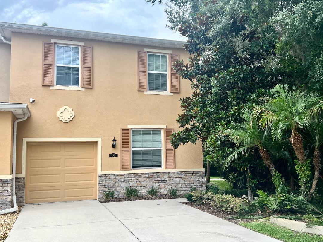 You will just love living in the Hidden River Townhomes—where luxury, location and lifestyle come together. This gated townhome community is just minutes from the University of South Florida and close to I-75 making so many amenities a short drive. Lettuce Lake Park is just moments away, offering scenic outdoor recreation, while convenient public transportation at the community entrance provides direct service to USF and downtown Tampa. This beautiful 3 bedroom, 2.5-bath townhome has a 1 car garage and showcases an open-concept design. The main level features elegant tile flooring, while the upper level offers comfortable carpeting in the bedrooms and hallway. The great room is enhanced by triple sliding glass doors that open to a private screened lanai with a view of the pond. The kitchen is highlighted by rich wood cabinetry and granite countertops, perfectly blending style and function. Additional features include a full appliance package—refrigerator, range, microwave, dishwasher, washer, and dryer. Residents enjoy resort-inspired living, including a resort-style pool and spa, sauna, elegant clubhouse, fully equipped fitness center, billiards room, business center, and peaceful walking trails throughout the community. This is a must see, schedule a showing today.