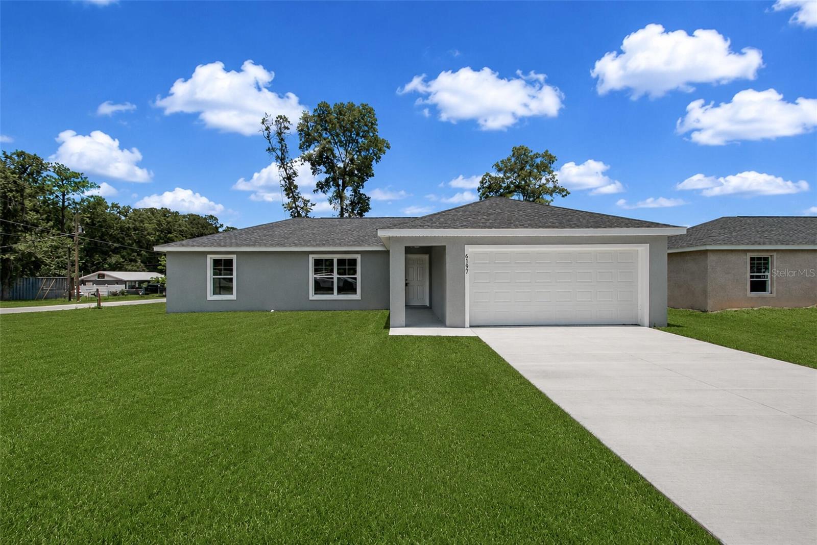 Virtually Staged. Brand-new construction featuring 3 bedrooms, 2 bathrooms, and a functional split-bedroom floor plan in Ocala Park Estates. The layout provides comfortable living with an open main living area that flows into the kitchen and dining space, while the primary suite is separated from the secondary bedrooms for added privacy. The backyard provides space to relax, entertain, or create your own outdoor retreat. Conveniently located just minutes from shopping, dining, and everyday amenities, with easy access to the World Equestrian Center. A great opportunity to own a new construction home at an affordable price in an established Ocala location.