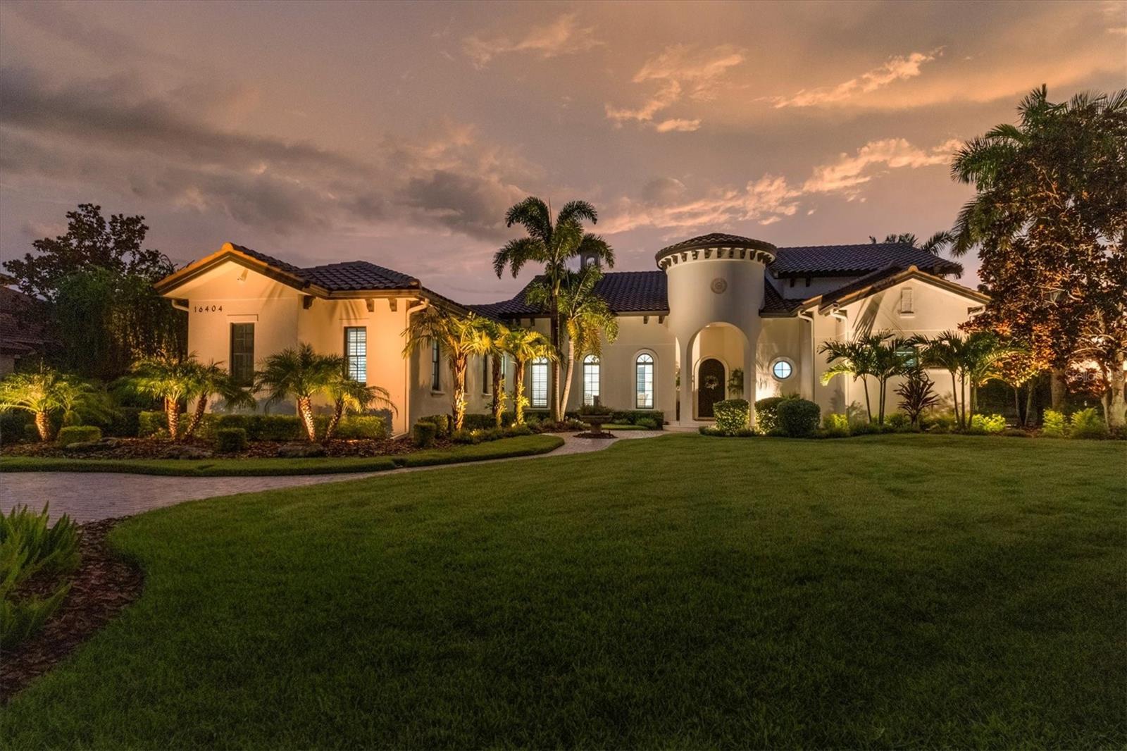 NEW PRICE!!! IMMEDIATE AVAILABILITY!!! WINTER IN FLORIDA!!! Just imagine you are entering your private villa on one of the secluded coves of Lake Como, yet you are in The Lake Club Phase I where each home offers a unique architectural style. Here you will find a variety of architectures from Tuscan to Georgian to Key West to Contemporary including custom reflecting the distinct and distinguishing imagination of builder and homeowner. Now Enter into your John Cannon exceptional and meticulously cared for 4-bedroom 3 bath lake front home on over 1/2 acre with outstanding curb appeal. This home has been remodeled and upgraded to meet the requirements of today’s discerning homeowner. The open floor plan is perfect for entertaining family and friends, yet the layout affords privacy for both homeowner and guests with a separate en suite bath in the casita style front bedroom with a separate entrance. The 3rd & 4th bedrooms share a full bath in rear of home with easy access to the spacious outdoor living area, outdoor kitchen and water featured pool and spa, all complemented by the expansive lake and preserve views. For the homeowner entertaining is made easy with the generously appointed kitchen which becomes the center of activity in the home. Your gourmet center comes with appliances from Wolf including SS 6 burner cooktop, SS convection MW, wall oven and DW, Sub-Zero built-in refrigerator, ample floor to ceiling wood cabinets and an oversized center island with waterfall ends, built in wine refrig, quartz countertops and can accommodate bar seating. This center provides seamless access to Family, Dining and Living rooms making it a delight to entertain. The home features are just endless and include featured high ceilings, ample crown and trim, electric fireplace in Living Room, arched solid wood speakeasy like front door, all on a lushly landscaped lot with mature trees. Wait there is much more like engineered hardwood flooring throughout, glass sliders with disappearing corner, stone wall has built in 80" television on a power adjustable mount and electric fireplace in Family Room. For the homeowner after a full day of entertaining or just relaxing by the pool, a retreat awaits in the primary bedroom with 2 walk-in closets, separate coat closets, a completely upgraded primary bathroom with separate vanities and generous state of the art lighting. Top all this off with a separate Den/Office off the primary bedroom affording maximum privacy for either relaxing or conducting business.  For the more infrastructure conscious there are impact resistant windows, whole house gas generator, multi zone separate A/C systems, 3 car oversized air-conditioned side entry garage, a water softener, water filtration system, tankless hot water system, recently painted exterior and newly screened lanai. Every corner of home both inside and out has been touched over the last few years making it like new. Don't miss out in being a resident at The Lake Cub Phase I, one of the most sought-after communities in Lakewood Ranch where the amenities include tennis, pickleball, resort style pools, fabulous dining at Clubhouse, dog park, playground and more. Optional membership in Lakewood Ranch Country Club with 4 golf courses is only a golf cart trip away. Shopping and dining options are numerous only a short drive to UTC Mall and downtown Sarasota, and some of the best beaches on the Gulf of America, come live the dream today!!! One photo is virtually staged...
