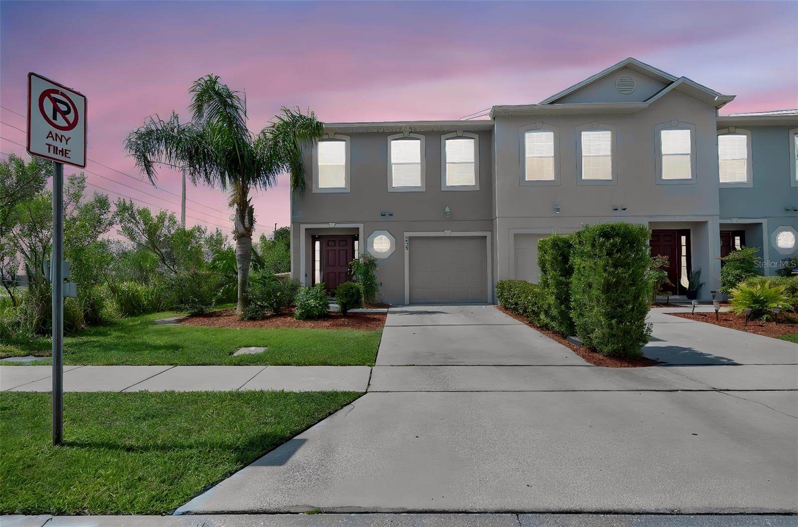 Welcome home to this beautifully maintained 3-bedroom, 2.5-bath corner-unit townhome offering 1,703 square feet of comfortable, low-maintenance living in Kissimmee! Nestled on a desirable corner lot at the end of a quiet cul-de-sac, this home offers added privacy, extra green space, and peaceful water views. Inside, you'll find an open-concept floor plan with durable tile flooring throughout the entire first floor, creating the perfect space for everyday living and entertaining. The spacious living and dining areas flow seamlessly into the kitchen, featuring ample cabinet and countertop space, a breakfast bar, and an open view of the main living areas. Sliding glass doors lead to a covered, screened patio, where you can relax while enjoying the tranquil water views. Upstairs, you'll find all three bedrooms along with a versatile loft, offering the perfect second living area, media room, home office, or play space to fit your lifestyle. The spacious primary suite includes an en-suite bath, while the additional bedrooms provide plenty of room for family or guests. Complete with a one-car garage, driveway parking, and the ease of low-maintenance townhome living, this home offers the perfect blend of comfort, convenience, and functionality. Conveniently located near shopping, dining, schools, major highways, and Orlando's world-famous attractions, this move-in-ready home is one you won't want to miss!