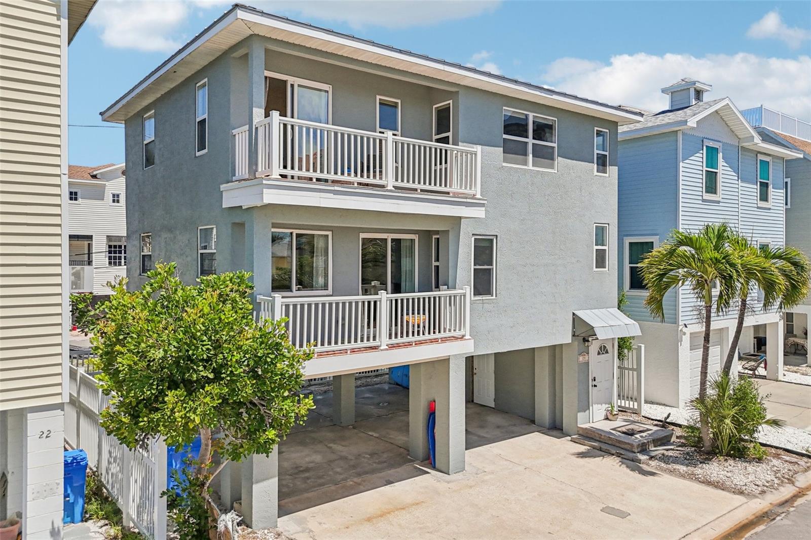 **Back on market - stairs unsuitable for buyer ** 3-STORY SINGLE-FAMILY BEACH HOME ON STILTS IN TREASURE ISLAND JUST STEPS FROM THE WHITE SANDS OF SUNSET BEACH. ELEVATED COASTAL LIVING AT ITS BEST offering enhanced safety, peace of mind, and a true island lifestyle in one of Treasure Island’s most desirable beachside locations. This 2-bedroom home with a flexible bonus area that can serve as a 3rd sleeping space with bunk beds features 2 full bathrooms and a bright, open layout across two levels. The first floor includes a well-appointed kitchen with solid wood cabinetry, marble countertops, and a classic copper farmhouse sink, along with a comfortable living room, dining area, one bedroom, and one bathroom. EACH LEVEL FEATURES OVERSIZED BALCONIES DESIGNED FOR OUTDOOR LIVING AND GULF BREEZES. The second floor offers a spacious Great Room, a versatile bonus area that can function as a third sleeping space, and a private primary suite with a relaxing clawfoot tub. The ground level provides ample storage, parking for up to four vehicles, and a convenient outdoor shower ideal after beach days. Located on the quiet south end of the island, the home is within walking distance to the beach and just minutes from the public boat ramp, local shops, and restaurants. ADDITIONAL FEATURES: DURABLE METAL ROOF, NEW WASHER & DRYER (2024), NEW REFRIGERATOR (2025), NEW DISHWASHER (2024). Exterior refresh credit (white paint) available with approved offer. FULLY FURNISHED AND MOVE-IN READY.