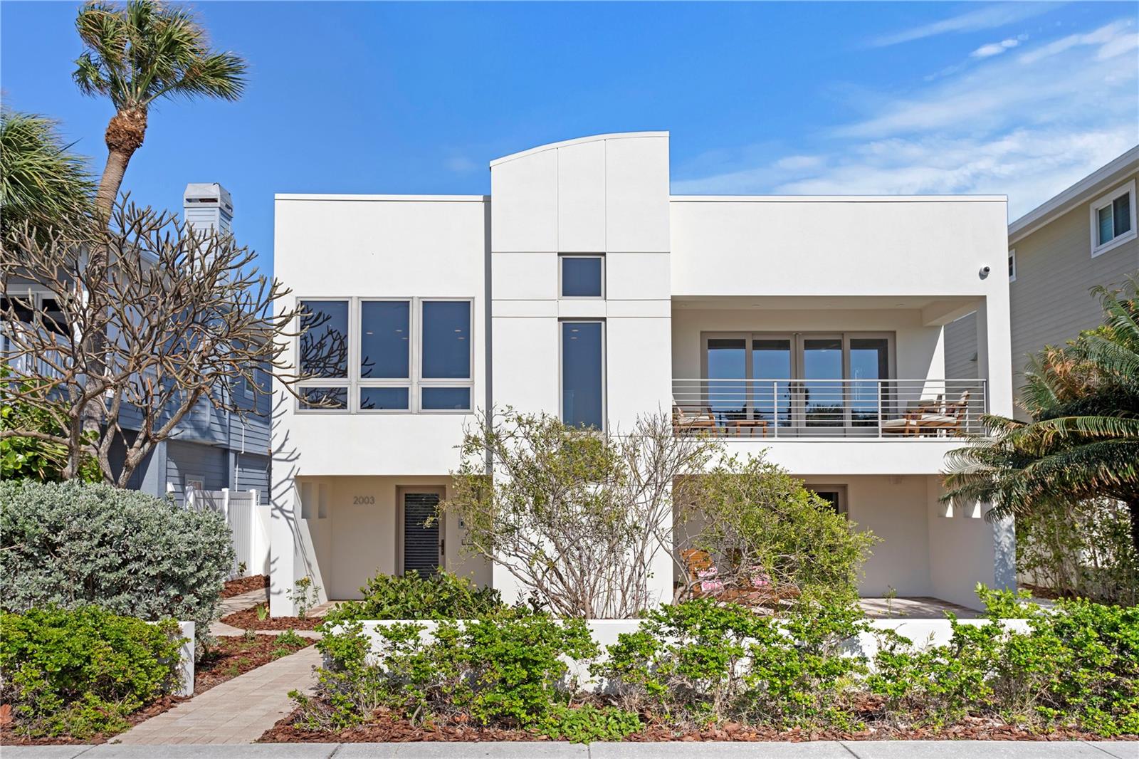 Modern Gulf-View Masterpiece | 4 Bed, 4 Bath | Custom Luxury Finishes. This contemporary architectural gem offers breathtaking, unobstructed
Gulf views and is move-in ready. Renovated in 2013, the home features approximately 2,350 sq. ft. of light-filled living space upstairs, with an
additional 1,600 sq. ft. on the lower level. Designed for elevated coastal living, this 4-bedroom, 4-bath residence includes a private elevator,
smart home automation, and two-zone HVAC for maximum comfort. Upper-level HVAC has UV Air Purification. The open-concept main living area
features wide-plank oak flooring, while all bathrooms are beautifully tiled. The chef’s dream kitchen boasts a custom gourmet setup, including: •
Viking 6-burner natural gas range with electric oven • Built-in Liebherr refrigerator • Miele dishwasher with panel matching cabinetry • Wolf builtin steam convection oven, warming drawer, and microwave • Quartz countertops The luxurious primary suite offers a spacious walk-in closet and
rich dark oak flooring complemented by powered window blinds for modern convenience. Step out onto a private outdoor tile deck, perfect for
morning coffee or evening relaxation. Additional amenities include laundry room, an entertainment bar area as well as a media room equipped
with a 75” Sony TV and surround sound. Built for durability and peace of mind, the home features Pella and Andersen hurricane-resistant
windows and sliding doors. Sprinkler system pump replaced, and all sprinklers inspected and operating 2025. The oversized garage
accommodates up to two vehicles. Roof is Rolled Modified Bitumen. Flood elevation is 9 feet. Bonus: Potential for a third-floor roof deck addition
to expand outdoor living and take in panoramic Gulf views