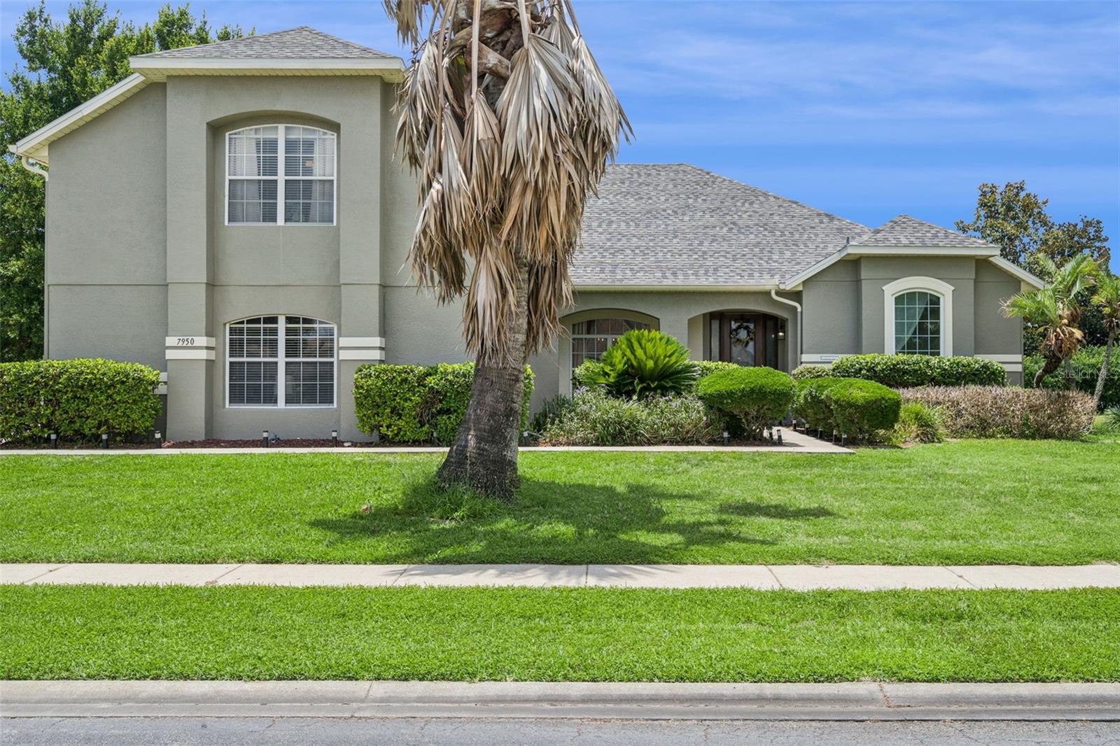 Welcome to 7950 Sea Pearl Circle, a beautifully upgraded 5-bedroom, 4-bath retreat tucked behind the gates of Formosa Gardens — one of Kissimmee's premier gated communities, with the rare flexibility to be enjoyed as a primary residence, second home, or short-term rental. Just minutes from Walt Disney World and set on an oversized half-acre corner lot, this nearly 3,200-square-foot Florida-style home offers space, privacy, and resort living in equal measure. In a market where most vacation-home communities require a car for everything, Formosa Gardens offers the rare luxury of walkable access to dining, shopping, and entertainment — a feature that's nearly impossible to replicate nearby. Major-ticket items are already handled — new roof (2022), new HVAC system (2023), new pool heater (2023), and new carpet throughout (2023). Smart thermostats and exterior security cameras let you monitor and control the home from anywhere via an app. Inside, an open floor plan with soaring ceilings flows from the kitchen and living areas to a primary suite on the main floor, with additional bedrooms upstairs. The standout feature is the fully air-conditioned and heated game room — the year-round entertainment hub guests and families rave about. Step outside to your private heated pool and spa with a screen enclosure, surrounded by deck space built for Florida sunshine. This is a true turnkey opportunity: all furniture, televisions, and games convey — ready to move in, enjoy as your getaway, or book from day one. Formosa Gardens' flexible use policy makes this home equally suited for a family looking for a forever home with resort amenities, a second-home buyer wanting a Disney-area escape, or an investor seeking an income-producing rental. Whatever your vision, 7950 Sea Pearl is move-in ready and waiting for its next chapter.