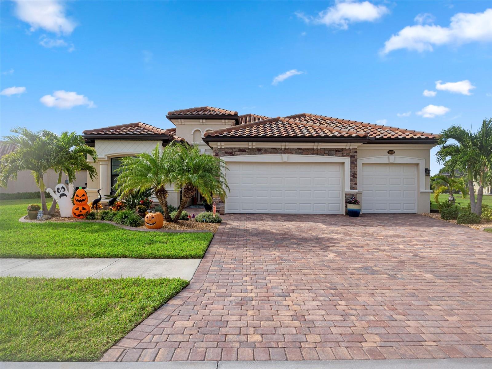 If privacy and a serene, wooded view is what you're looking for - this is the home for you!  This 3 bedroom, 2 bath, 3-car garage pool home is nestled on a very private and oversized lot.  With no home next door or behind, you'll enjoy quiet and relaxing time in your lanai.  You will love the custom-designed heated saltwater pool with color-changing LED light, custom handrail, lanai LED lights, cypress wood lanai ceiling and wall mounted outside TV.  This area is the ultimate spot for entertaining!  Interior upgrades include:  custom trim & built-in living room cabinets, wall-mounted TV, quartz countertops, over and under-cabinet lighting, upgraded appliances, frameless glass shower enclosure, ceiling fans, custom closets, front door invisible screen, built-in ironing board, surge protector and garage storage.  Outside, you'll find:  beautiful landscaping with flower bed curbing and stone, hurricane shutters, roof vent baffles and gutters.  No carpet in this home!  All of this, in a fantastic location!  Just 2.4 miles to vibrant Downtown Wellen Park, 3 miles to Cool Today Park and 8.5 miles to the nearest beach.  Shops, restaurants and medical facilities nearby, along with easy access to I-75 and all area airports.  Gran Paradiso is a fantastic, Tuscan-style gated community.  Abundant amenities, including:  full time activities director, resort-style pool and spa, tennis, basketball, pickleball, state-of-the-art fitness center, sauna & steam rooms, billiards room and ping pong.  Included in your HOA fees:  access to all community amenities, mowing & edging, cable, internet and daytime gate guard.  This type of home - on a lot this private - doesn't come along often!  Schedule your private showing today!