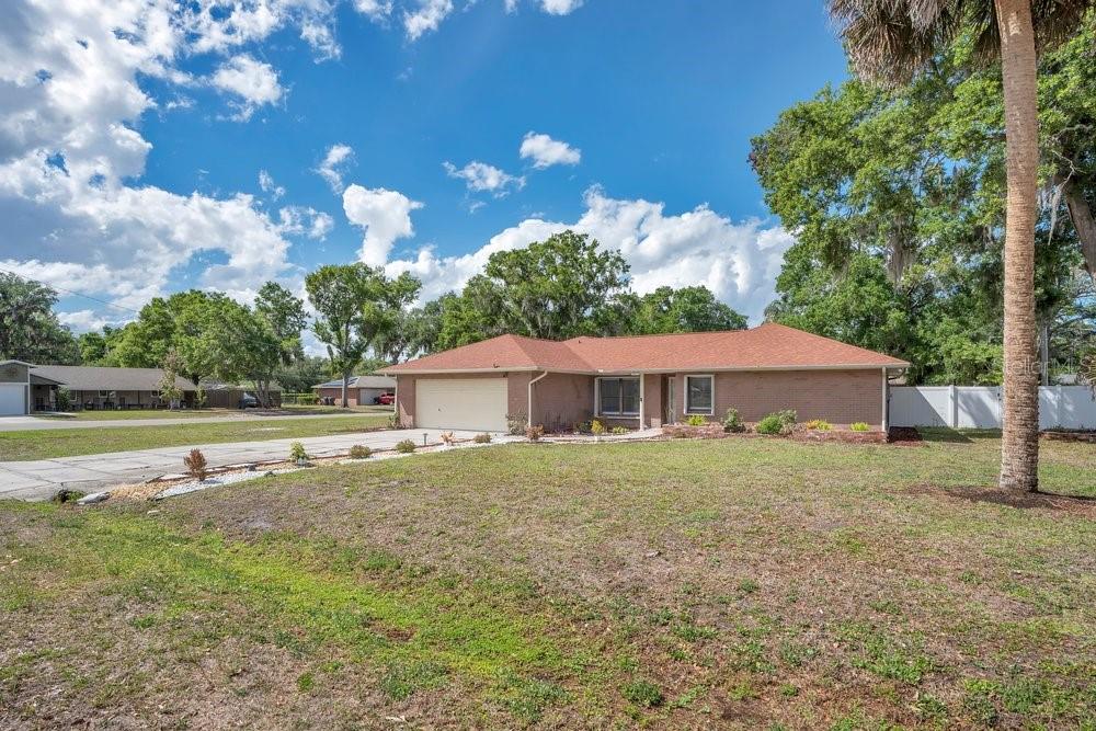 Priced WELL BELOW appraised value! A tastefully updated well maintained one-level 4 bedroom single family home on a spacious & fenced corner lot with NO HOA or CDD. New Roof in 2025 & Accordion Hurricane Shutters for your peace of mind.

Inside, enjoy over 2,100 SqFt of thoughtfully distributed living space with seamless tile flooring throughout. The kitchen remodel features granite countertops, stainless steel appliances, wood cabinetry, and a pantry closet. The primary suite includes a walk-in closet, dual granite vanity, and a STANDOUT designed spacious tiled shower.

A perfectly remodeled low maintenance single-story home on a private fenced corner lot ready for immediate move-in. Schedule your private tour at your convenience.