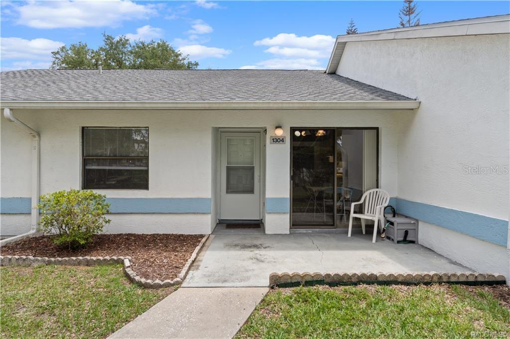 One or more photo(s) has been virtually staged.  **Who lives across the street from a lake, with access to a boat ramp, boat dock, and a dog park... in a maintenance FREE condo with a community POOL for UNDER $160k??*** Could be YOU! Water views from your front door? Yes please! This 2/2 condo provides you a lifestyle, not just a home. When you walk in, you have an eat in kitchen area in front of sliding doors to your front patio, perfectly positioned by the kitchen that looks over to the living room/dining room area. The living room has vaulted ceilings and a spacious layout! Right off of the living room is the year-round room that is extremely desirable and versatile for enjoying an additional living space and places to enjoy time feeling the Florida breeze! Inside the master bedroom has ample space and a large fully walk in closet. There is also an in suite bathroom with a shower. The guest bedroom is separate by the front of the home with the guest bathroom right outside of the bedroom. There is also a laundry area by the guest bathroom with a stackable unit. Inquire about the rules and regulations for boat storage, and pet restrictions. Pets are allowed within restrictions. The community has so much to offer with the community pool, walking trails, a dog park, and literally a boat ramp and dock right by this unit! Ramp is on Lake Spivey and you have access to the Tsala Apopka Lakes! Do not miss your chance to see this one before it's gone!! HVAC is 2024, Storm door 2024, New interior paint 2024, Washer and dryer 2024, rescreened lanai 2024.