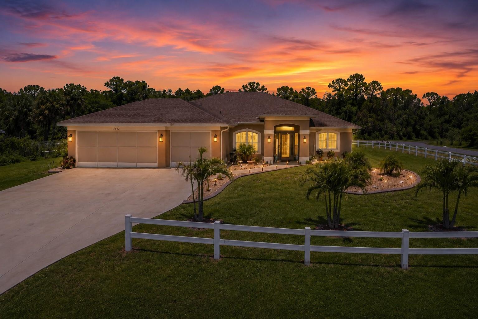Virtually Staged. Why wait months to build when you can own this beautifully upgraded, move-in-ready home today? Built just two years ago, this stunning 4-bedroom, 3-bathroom home with a dedicated den, 3-car garage, and 2,269 square feet of living space sits on an oversized corner lot and offers the perfect combination of modern construction, thoughtful upgrades, and everyday comfort—all with NO HOA, NO CDD fees, and located in a desirable X Flood Zone (NO FLOOD insurance required).

From the moment you arrive, you'll notice the exceptional curb appeal, enhanced by professional landscape curbing with decorative river rock surrounding the entire home and a ranch-style fence enclosing the property, creating a polished appearance while offering added privacy and functionality.

Inside, you'll find a spacious open-concept floor plan designed for both entertaining and everyday living. The dedicated den provides the flexibility for a home office, media room, or guest space, while the split-bedroom layout offers privacy for family and visitors. Every room has been thoughtfully upgraded with custom plantation shutters, creating a timeless look while adding elegance and energy efficiency throughout the home. Six ceiling fans have also been installed throughout the bedrooms, living room, and den for year-round comfort.

Enjoy Florida living to the fullest from the screened front porch and expansive screened lanai, allowing you to relax outdoors without the nuisance of insects. Even the garage has been upgraded with two retractable garage door screens, creating the perfect space for hobbies, projects, entertaining, or simply enjoying the breeze. The garage is also equipped with two automatic garage door openers and four remotes for added convenience.

Additional improvements include gutters installed along the rear of the home, helping protect the property while reducing maintenance.

The home also includes a 2-year-old Frigidaire Gallery kitchen appliance package, along with the washer and dryer, making your move even easier.

Situated in one of North Port's fastest-growing areas, you'll enjoy convenient access to shopping, dining, schools, golf, parks, beaches, the Atlanta Braves Spring Training facility, and I-75 for an easy commute.

This is far more than a builder-grade home—it's a thoughtfully upgraded property where the work has already been done for you. Beautifully maintained, loaded with upgrades, and offered at an exceptional value, this is an opportunity you won't want to miss. Schedule your private showing today!