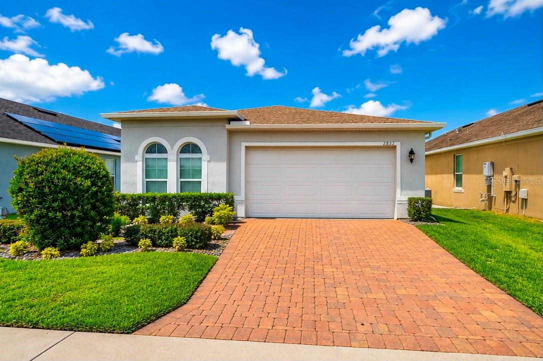 Welcome to Arden Park North, a sought-after gated community offering comfort, convenience, and exceptional amenities. This beautifully maintained 3-bedroom, 2-bathroom home features an inviting open-concept design that seamlessly blends everyday living with effortless entertaining.

Step inside to discover a spacious kitchen overlooking the family room and dining area, creating the perfect gathering space. The kitchen is thoughtfully appointed with an oversized island, stainless steel appliances, stylish cabinetry, abundant storage, and a large walk-in pantry. Tile flooring flows throughout the main living areas, adding both elegance and easy maintenance.

The private owner's suite serves as a relaxing retreat, complete with a luxurious en-suite bathroom featuring dual vanities, a walk-in shower, and an expansive walk-in closet. Two additional bedrooms provide flexibility for family, guests, or a home office.

Beyond the home, Arden Park North is renowned for its distinctive architecture, majestic oak trees, and picturesque Florida meadows. Residents enjoy resort-style amenities, including a sparkling community pool, clubhouse, fitness center, playgrounds, scenic parks, and direct access to the West Orange Trail—a 22-mile recreational trail ideal for biking, jogging, and walking.

Conveniently located just minutes from State Road 429 and Florida's Turnpike, this home offers easy access to downtown Orlando, Walt Disney World, Universal Orlando Resort, and Orlando International Airport.

Don't miss this opportunity to live in one of Ocoee's most desirable communities. Schedule your private tour today!