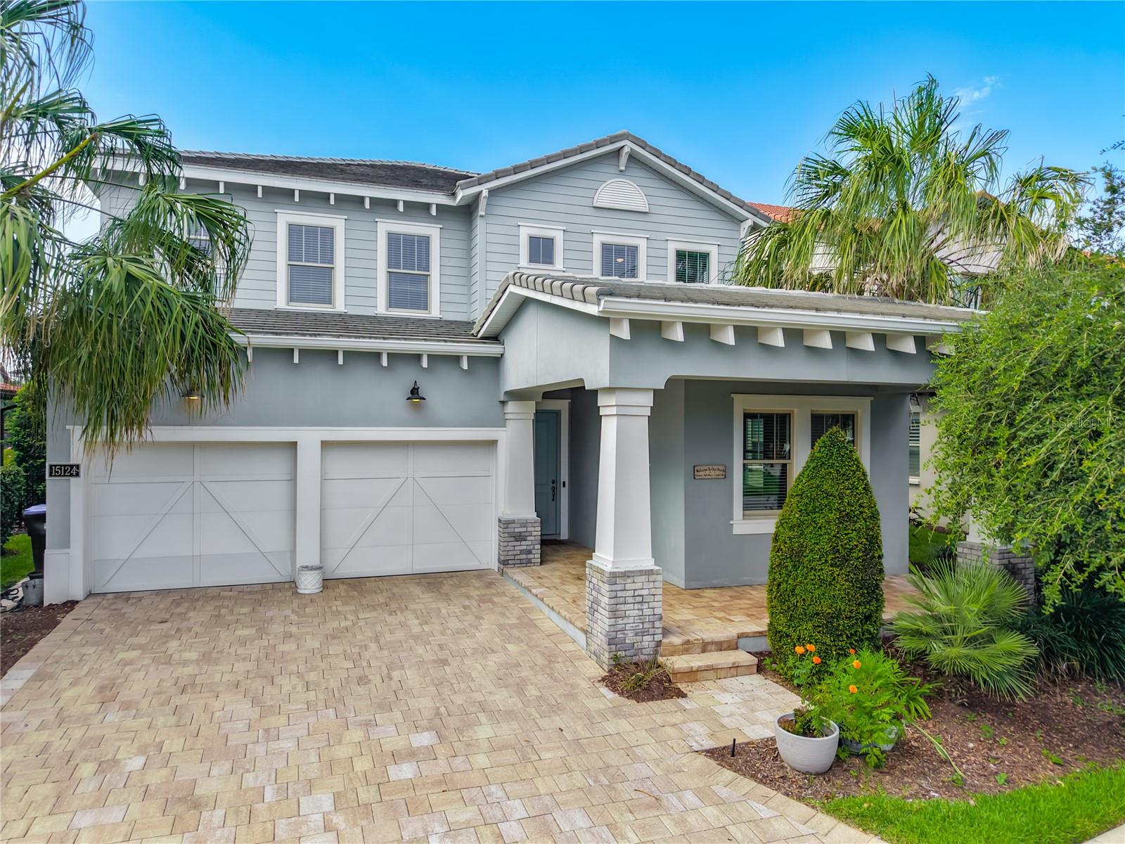 Stunning Toll Brothers "Madeira Craftsman" executive home located in Winter Garden’s highly desirable Lakeshore community! Offering 5 bedrooms, 4.5 bathrooms, with a large bonus loft, and a 3-car tandem garage. The light-filled, open-concept floor plan showcases elegant tray/coffered ceilings and a high-end chef's kitchen with quartz stone counters and a large island. Unwind in the great room with spectacular nightly views of the Disney fireworks. The first-class outdoor living area features a massive screened-in pool, a covered lanai, and a built-in summer kitchen—perfect for entertaining! The large bright luxurious primary suite comes with a free-standing tub and walk-in shower. Enjoy world-class community perks: a lakefront clubhouse, fitness center, beach volleyball, and paddleboarding/kayaking on Panther Lake. Minutes from Disney and Horizon West shopping!