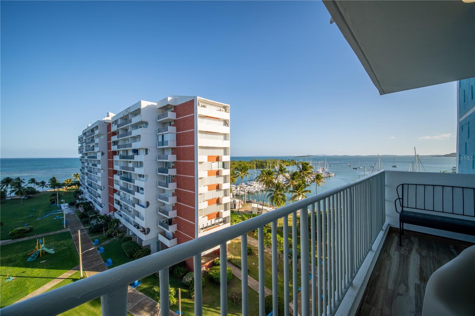 This 8th floor unit at Isleta Marina features ocean and marina views, three private balconies, and a full renovation completed three months ago. Sold fully furnished with stylish boho decor, it is ready for immediate personal use or short term rental income.

Fully remodeled 2 bedroom, 2 bathroom condo with 873 sqft located in the private island community of Isleta Marina in Fajardo.

The unit was completely renovated just three months ago and is sold fully furnished and turnkey, including furniture, decor, and appliances as shown. The interior features a clean open layout, modern kitchen finishes, and curated boho style decor that photographs well and appeals to vacation rental guests.

Three private balconies offer distinct views:

• Living room balcony facing Fajardo town and El Yunque Rainforest
• Two balconies overlooking the ocean, marina, and Isla Palominos
• Consistent ocean breeze and panoramic water views

Short term rentals are allowed, making the property suitable for Airbnb investment or a second home in Puerto Rico.

Community amenities include:

• Two pools
• Tennis, basketball, and volleyball courts
• Picnic areas and waterfront common spaces
• Private ferry to the mainland every 15 minutes included in HOA

Parking includes one assigned space at Fajardo Marina, as vehicles are not allowed on the island itself.

Nearby destinations include Icacos Beach, El Yunque Rainforest, Isla Palominos, El Conquistador Resort, marinas, sailing, snorkeling, and restaurants.

A rare opportunity to own a 2 bed waterfront condo in Fajardo Puerto Rico in one of the island’s most distinctive waterfront communities.
