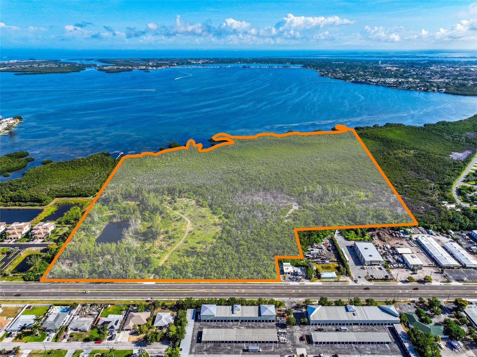 Located in Southwest Bradenton along Cortez Road, this offering presents a rare opportunity to acquire approximately 58 acres for a high-end luxury residential development project.

The property is fully-entitled for 148 units with Final Site Plan approval for 44 townhomes and 104 apartment-style condominiums. These units may be for rent or for sale. The townhomes average 2,400 square feet and include two covered parking spaces per unit and the condominiums average 1,100 square feet. The approved development features amenities such as a resort-style pool, grilling areas and a fire pit. 

A standout feature of the property is nearly 3,000 feet of shoreline along Palma Sola Bay, situated within a dedicated nature preserve, which provides a tranquil environment for residents.

With prime frontage on Cortez Road, the site benefits from strong visibility and an average daily traffic count of approximately 30,500 vehicles. It is located less than three miles from Bradenton Beach and offers convenient access to US-41 (Tamiami Trail), IMG Academy and the site is a quick twenty-minute drive to Sarasota-Bradenton International Airport, which offers nonstop flights to 56 destinations as of May 2026.

Major retail centers in close proximity are the Paradise Bay Shopping Center, which features Marshalls, Home Goods, Starbucks and First Watch, along with the long-awaited SeaFlower development, which will include Publix, Whataburger, Dutch Bros Coffee, and Potbelly Sandwich Works, among other retailers and restaurants, a brewery, hotel and luxury apartments in Phase I. 

The surrounding area is known for its recreational amenities, including the Bradenton Gulf Islands, nature preserves with kayaking, walking and biking trails, and several high-end golf courses, including Bradenton Country Club and Sara Bay Country Club.