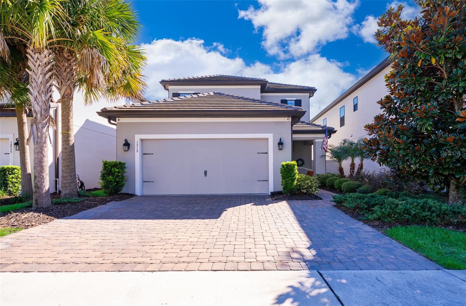 Welcome to this stunning two-story, 3-bedroom, 3 and a half bathroom home, nestled within the highly desirable Winter Park in a secure gated community. This kitchen boasts luxury features including quartz countertops, stainless steel appliances and rich dark wood cabinets. The master bedroom, with a spacious bathroom and walk-in closet, is conveniently located downstairs for added convenience.

Upstairs, you'll find a second master suite, a third bedroom and a generous loft, providing ample living space. Enjoy the tranquil conservation view with no rear neighbors from the comfort of your fenced-in backyard, complete with a built-in grill area and a fireplace, perfect for entertaining or relaxing.

This community offers resort-style living with a huge pool, cabanas, fitness center, and a beautiful clubhouse managed onsite. Embrace the picturesque surroundings with a private lake and dock featuring a kayak launch. The HOA takes care of ALL yard maintenance, ensuring a hassle-free and maintenance-free lifestyle. Plantation shutters adorn every window, adding a touch of elegance. Don't miss out on this exceptional Winter Park home offering luxury, convenience, and a serene setting.
