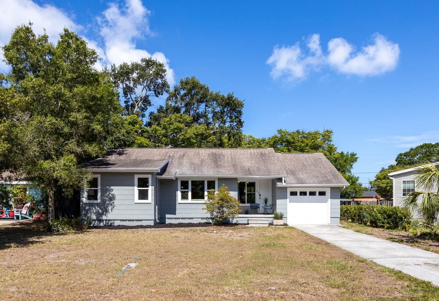 Welcome to 1024 Michigan Drive E, a charming 2 BEDROOM, 1 BATH Dunedin home with an attached 1 CAR GARAGE, garage half bath and fully fenced backyard....... Set in a convenient location just minutes from Downtown Dunedin, Mease Dunedin Hospital, the Pinellas Trail, Toronto Blue Jays Stadium, local restaurants, breweries, parks and waterfront favorites, this home offers an appealing opportunity for a first-time buyer, seasonal owner, downsizer or buy-and-hold investor looking for a smaller home where they can settle in now while still having some things they can do at their own pace........... Inside, the home has a light, comfortable feel with original HEART OF PINE WOOD FLOORS, a dedicated living room, separate dining area and a tongue-and-groove paneled flex room that adds warmth and character.......... This flexible space could work nicely as a sitting room, office, hobby area or informal bonus room....... Practical updates include a 2021 HVAC system, impact-rated windows installed in 2020/2021, hurricane-rated garage door, updated electrical panel, fresh interior/exterior paint, fully fenced back yard and a walk-up attic with excellent storage.......... The extra-long garage provides space for the washer/dryer, workbench, access to the back yard and, as mentioned, the added convenience of a half bath.......... This house is also in Flood Zone X where lenders do not require flood insurance and a NON EVACUATION ZONE!!!....... With its cozy scale, classic wood floors, useful storage, fenced yard and close proximity to the heart of downtown Dunedin, this home is a great opportunity to put down roots, enjoy the location and make it your own over time....... Schedule your private showing and come see the potential for yourself.