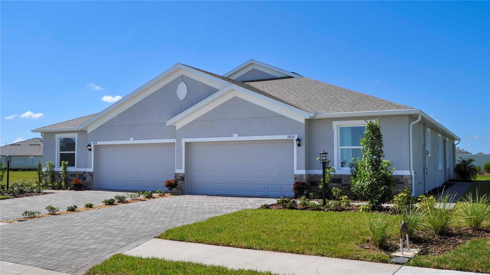 Under Construction. Receive up to $10,000 towards closing costs & special interest rates with the use of our preferred lender - Now through June 30th.
This one-story, all concrete block constructed home has a truly open concept plan, featuring a spacious kitchen with a large quartz kitchen island that overlooks a large dining area, great room, and breakfast nook which flow out onto a covered lanai. The first phase of The Resort Club amenity center is NOW OPEN, including Trade Route Coffee Kitchen, Resort Style Pool, Fitness Center, Athletic Performance Center, and Pet Park. Future phases of The Resort Club will include a poolside bar & grill, outdoor activities area, The Event Center, and The Terrace Chef’s Patio. Future amenity centers, Adventure Retreat & Cabana Corner, will include Pickleball, Tennis & Bocce Courts, Pet Park, Golf Cart Parking, Sunset Terrace, Clubhouse, Resort Pool & Spa, Resistance Pool, Poolside Cabanas & Beach Area, Outdoor Activities Area, Poolside Grilling and more. This home comes with stainless steel dishwasher, range, and microwave. Pictures, photographs, colors, features, and sizes are for illustration purposes only and will vary from the homes as built. Home and community information including pricing, included features, terms, availability and amenities are subject to change and prior sale at any time without notice or obligation.