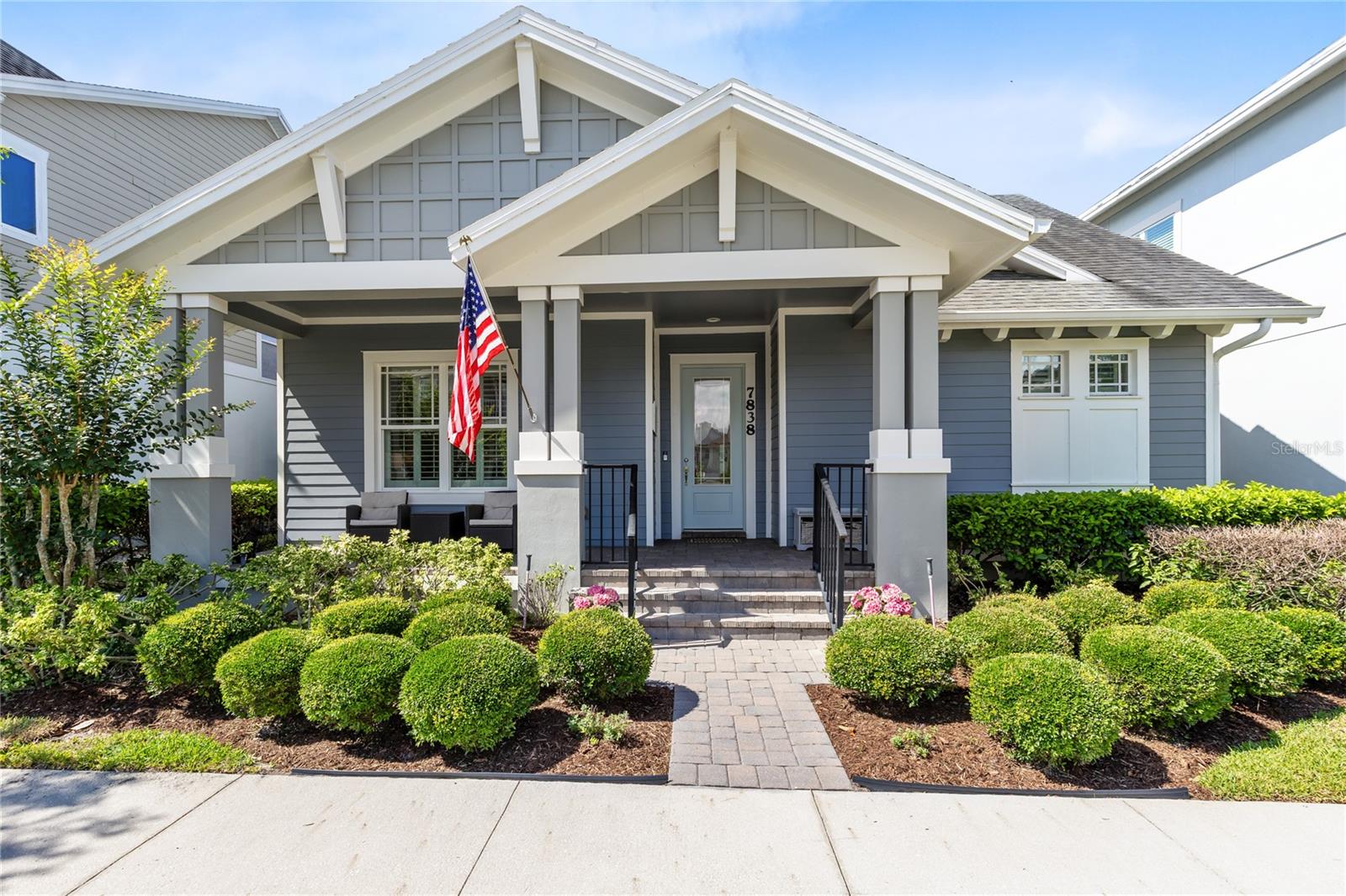 Welcome to this beautifully upgraded single-story Minto Nicole home in the heart of Laureate Park, offering 3 bedrooms, 2 bathrooms, a dedicated office, and 2,342 square feet of thoughtfully designed living space. From the moment you enter, the home feels bright, open, and elevated, with wood-look tile flooring, crown molding, tray ceilings, plantation shutters, and custom stacked-stone details that add warmth and character throughout.

The main living area is designed for everyday comfort and easy entertaining, with an open-concept layout connecting the great room, dining area, and gourmet kitchen. The kitchen features white cabinetry, stone countertops, a large island with seating, stainless steel appliances, double oven, cooktop, range hood, tile backsplash, and generous storage. The dining area is framed by beautiful lighting and built-in-style cabinetry, while the great room offers a spacious gathering area with a stacked-stone feature wall and views toward the private outdoor retreat.

The primary suite is tucked away with its own custom feel, featuring tray ceilings, a stacked-stone accent wall, plantation shutters, and a large walk-in closet with custom organization. The primary bathroom includes dual vanities, a soaking tub, and a walk-in shower. Two additional bedrooms with newer carpet, a full bath, and a dedicated office provide flexible space for guests, work, or hobbies.

Step outside through the French doors to a backyard made for relaxing and entertaining. The covered patio opens to a private heated saltwater pool with a sun shelf, water feature, pool lighting, paver deck, artificial-turf putting green, fenced yard, and professional landscaping, creating a true outdoor extension of the home. A rear-facing detached 2-car garage with alley access, garage door opener, and custom storage cabinets adds convenience while keeping the front elevation clean and welcoming.

Notable updates include the saltwater pool in 2020, professional landscaping and custom storage improvements in 2021, professionally painted interior in 2021, professionally painted exterior in 2023, whole-house water softener in 2023, and new carpeting in the guest bedrooms in 2024.

Located in Laureate Park, one of Lake Nona’s most sought-after communities, residents enjoy access to resort-style amenities including pools, fitness center, parks, playgrounds, dog park, clubhouse, trails, community dining, and neighborhood events. The sellers especially love being able to enjoy miles of nearby walking and biking trails, including a neighborhood nature trail just a short walk from the home. Just minutes from Lake Nona Town Center, Medical City, USTA, KPMG, shopping, restaurants, Moss Park, Nona Blue Tavern, Canvas, and major roadways including 417 and 528, this home combines upgraded single-story living with one of Orlando’s most connected lifestyles.