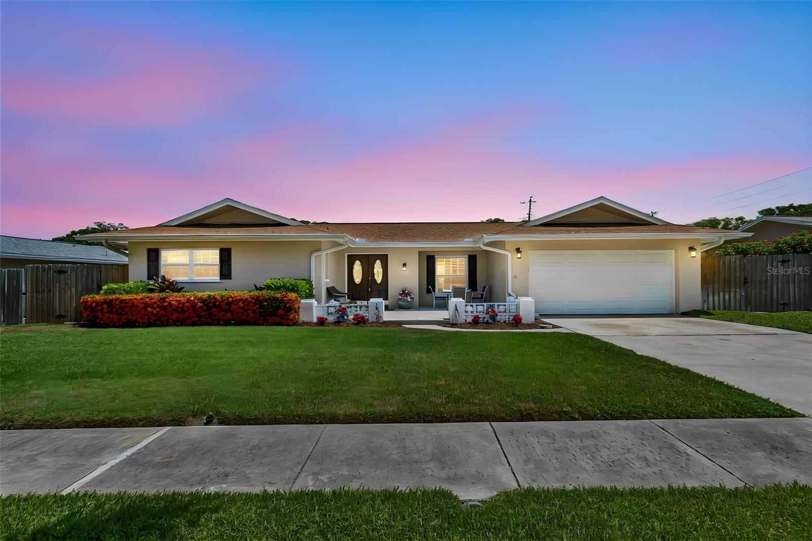 Welcome to sought-after Yacht Club Estates, where comfort, convenience, and Florida living come together! This meticulously maintained 3-bedroom, 2-bath home offers 1,524 square feet of thoughtfully updated living space on a spacious lot designed for enjoying life both indoors and out. Step outside to your own backyard retreat featuring a large saltwater pool, plenty of yard space for entertaining or play, and two storage sheds for all your tools, toys, and hobbies. Inside, you'll appreciate the fresh interior and exterior paint, new carpet in the primary bedroom, and a beautifully reglazed primary shower and tub backed by a transferable 5-year warranty. Major updates provide peace of mind, including a 2017 roof, 2019 HVAC system with updated ductwork, a new hurricane-rated garage door with smartphone app connectivity, water softener, and an upgraded sprinkler system with two new well heads and a new well pump. Located in unincorporated Pinellas County, this home offers the flexibility of allowing short-term rentals while being situated in a non-flood insurance required, non-evacuation zone. Just minutes from award-winning Gulf beaches, parks, shopping, dining, and top-rated schools, this is an exceptional opportunity to own in one of Seminole's most desirable neighborhoods. Don't delay, schedule your appointment today!