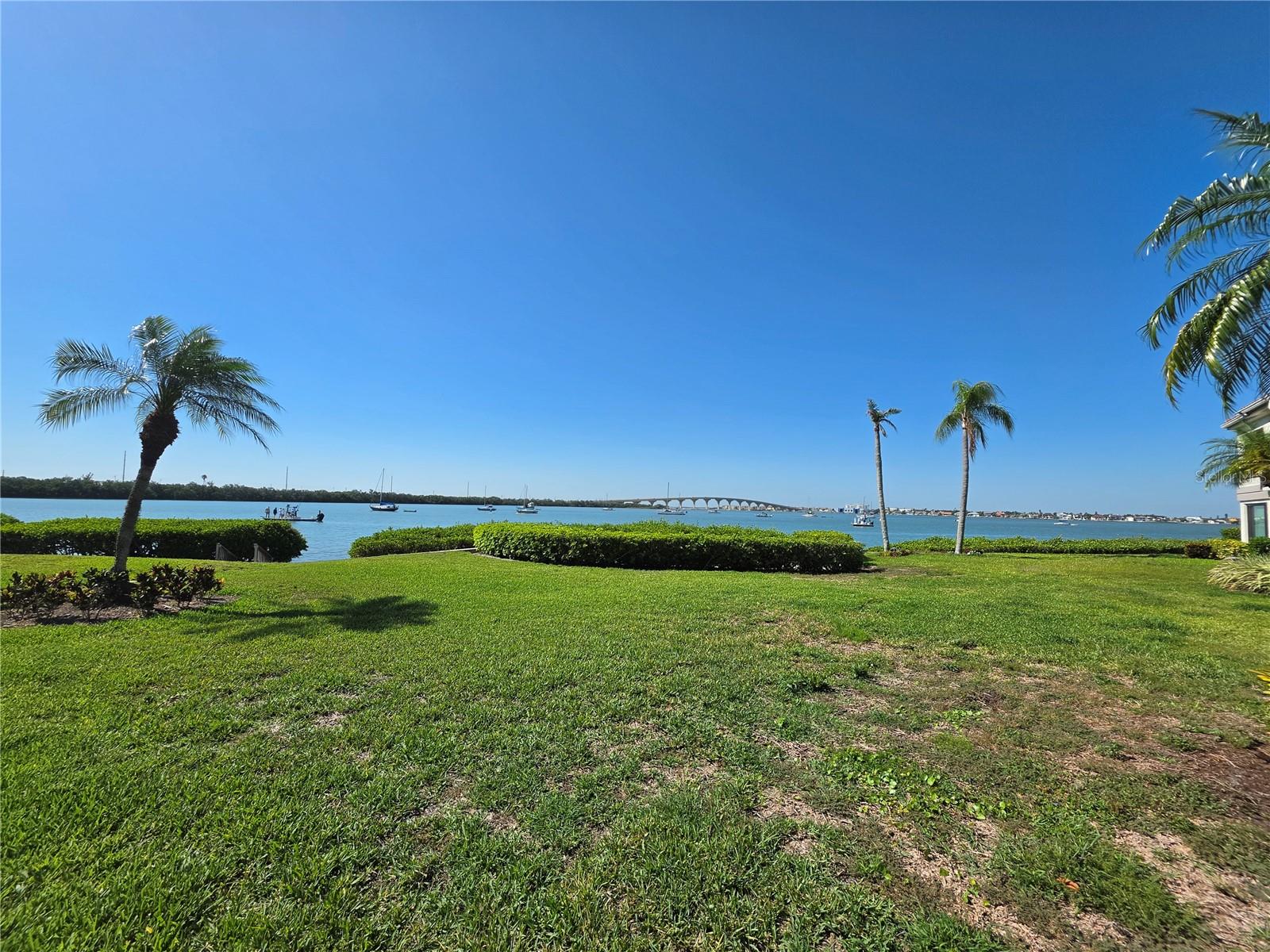Settle into island living in this beautifully maintained 2-bedroom, 2-bath first-floor condo in the desirable Bahia Del Mar community on Isla Del Sol. Bright, inviting, and fully turnkey, this spacious retreat features an open-concept layout, comfortable furnishings, updated finishes, wireless internet, flat-screen TVs, and generous storage throughout.

The well-appointed kitchen opens seamlessly to the living and dining areas, creating an ideal space for relaxing or entertaining. Both bathrooms have been tastefully updated with modern finishes and walk-in showers for added comfort and convenience.

Start your mornings with coffee on the private patio overlooking the lush tropical landscaping and sub-tropical waters of Boca Ciega Bay, then enjoy the resort-style pool and spa just moments away. Residents also have access to bike storage and the nearby clubhouse, complete with a fitness center, library, and community gathering room.

Ideally located next to Isla Del Sol Yacht & Country Club and just minutes from Fort De Soto Park, St. Pete Beach, Gulf Boulevard’s restaurants and shopping, waterfront recreation, vibrant downtown St. Petersburg, I-275, and two international airports, this exceptional condo offers the perfect combination of relaxation, convenience, and the Florida Gulf Coast lifestyle.

Association approval is required.