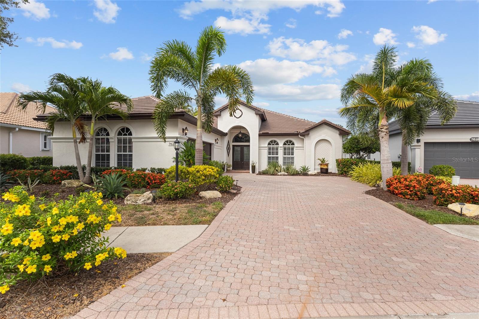 Welcome to the highly sought-after Lakewood Ranch Country Club! This beautifully Updated, Maintenance-free home offers 2 Bedrooms, 2 Bathrooms, plus a private office that can easily serve as a third bedroom. Meticulously maintained and thoughtfully upgraded from top to bottom, this ~TURNKEY FURNISHED~ home (excluding a few personal items) is truly move-in ready. The gorgeous Gourmet kitchen features Quartz countertops, Soft close doors and Drawers, a large center Island, abundant Cabinetry, and is perfectly designed for entertaining. The spacious open-concept living area showcases a stunning stone accent wall with a fireplace that creates a striking focal point, while beautiful tile flooring throughout the main living areas and warm wood flooring in the bedrooms provide both elegance and comfort. The spacious Primary suite offers a peaceful retreat with an oversized Walk-in closet plus an additional closet for exceptional storage. Primary bathroom is fully custom renovated with custom shower, soaking tub with a serene view out to the preserve. Step outside to the screened lanai and relax while enjoying tranquil water views overlooking a Private Preserve, where beautiful birds and wildlife create a serene backdrop. A gas stub-out for your barbecue makes outdoor entertaining effortless. Additional upgrades include a custom front door, newer interior and exterior paint, a new tile roof, a 3-year-old HVAC system, a 3-year-old water heater, hurricane accordion shutters, and Kevlar shutters for added peace of mind. Residents enjoy a gated, maintenance-free community with a private community pool included in the HOA. Ideally located just minutes from Waterside Place, downtown Lakewood Ranch, premier shopping, restaurants, golf, and entertainment. Lakewood Ranch, the nation's top-selling master-planned community, offers an unmatched lifestyle with optional Country Club membership and is just 30 minutes from Florida's world-renowned Gulf Coast beaches.