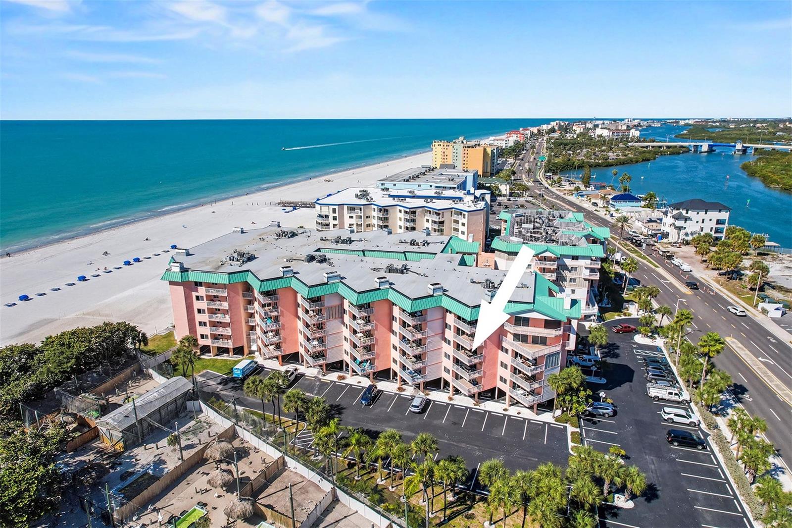 Experience coastal living at its finest in this exquisite two-bedroom, two-bath beachfront condominium offering 1,400 square feet of thoughtfully designed space and sweeping Gulf views. Sunlight fills an open living and dining area anchored by a cozy fireplace and flowing directly to a large beach facing balcony, ideal for morning coffee or endless sunsets. The spacious kitchen features a breakfast nook and ample cabinetry and counter space, while an inside washer/dryer adds everyday convenience. The split bedroom layout ensures privacy, a generous primary suite boasts water views, private balcony access to spacious bath with dual vanity and a large renovated shower. A second bedroom and bath accommodate guests comfortably. Resort-style living continues outdoors with a heated pool, expansive sun deck, grilling station, and direct views of sugar sand beaches and sparkling water. Practical amenities include assigned under-building parking, abundant guest spaces, bike and kayak storage, and weekly rentals permitted, ideal for strong income potential, a second home or full-time residence. Near fishing, boating, paddle boarding, beachcombing, local restaurants, boutiques, live music and trolley service, and convenient to two international airports. Schedule your appointment today.
