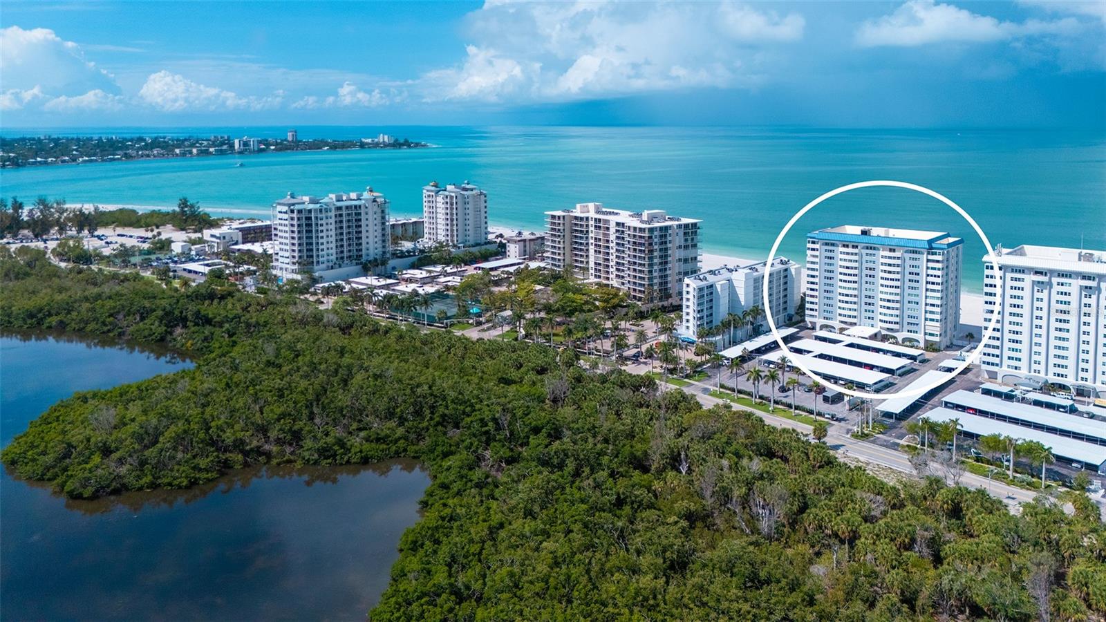 Experience the best of beachfront living at Key Tower South on Lido Beach. The expansive beach views literally take your breathe away the minute that you walk into the lobby.  As your guests enter this spacious 1,781-square-foot residence, their first impression will be the lovely hospitality bar in the large foyer area.  This well-appointed unit features a large open living and dining area bordered by a 23 foot long sunroom. * * * There are two generous bedrooms plus a versatile den with a built-in Murphy bed concealed within attractive custom wood cabinetry.  
Large travertine stone tile flooring flows throughout the main living areas, while the primary suite offers brand-new carpeting, two large walk-in closets, a dual sink vanity, a comfort-height toilet, a walk-in shower and its own private sunroom. Abundant storage throughout the entire residence adds to its everyday convenience and the recessed lighting adds a contemporary feel.  The kitchen is well laid out with lots of counter space and areas for admirers or critics to pull up a bar stool and watch the chef work their magic. * * *
Enjoy the peaceful eastern exposure on the private terraces off both the living room and primary bedroom, providing inviting sunlit spaces to relax and take in views of the Sarasota skyline, which sparkles beautifully after sunset. One of the home's two air-conditioning systems is brand new and the other was installed in 2022. * * *
Key Tower South has undergone extensive renovations, including a complete transformation of the lobby and common areas in 2025. The building also features its own perimeter hurricane and storm-surge protection system for added peace of mind.
Residents enjoy 220 feet of private Gulf-front beach, direct beach access, a heated beachfront pool, expansive sun deck, fitness center, saunas, library, bike storage, and on-site management. This exceptional residence offers the comfort, convenience, and lifestyle that make Lido Beach one of Sarasota's most desirable waterfront destinations.