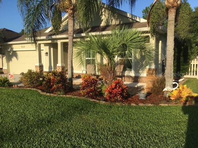 Beautiful 4 Bedroom, 2 Full Baths Split floor plan, concrete block stucco/stone home.  In wonderful SUGAR MILL GARDENS with available membership amenities to SUGAR MILL COUNTRY CLUB, golf, tennis, picketball, fitness center, pool, dinning and all social activities.  Front Porch has inviting sitting area over looking nice landscaping. Back of the home has screened in Lanai, wall mounted TV and with two paver patios for entertaining or barbecuing.  Privacy in your backyard (not looking at another home directly behind), yard completely fenced with attractive vinyl fencing, room for a pool.  Yard has a banana tree, avocado tree, bird of paradise and blooming trees and plants to enjoy.  Entering home through leaded glass front door foyer, 10-feet high ceilings contribute to the openness of the dining, living and the kitchen areas.  Bamboo flooring stretches from the foyer through the living area into the master bedroom.  Kitchen has ceramic tile and tile in all wet areas.  Master bedroom has trey ceiling with his and hers walk-in-closets.
Master Bath has light gray cabinets, walk-in shower and jetted tub.  The kitchen boasts of 42-inch light gray cabinets, granite countertops and stainless-steel appliances, breakfast bar and walk-in pantry.  The inside laundry room includes a deep utility sink and cabinets with shelving.  Two car garage and electric outlet for freezer and refrigerator.  Home has plantation shutters, blinds and window treatments included. ADT security system. reclaimed water irrigation system.  Transferable termite bond . 5.5 miles from the Beach.  Drive your golf cart to SMCC for Golf.  All information intended to be correct Buyer needs to verify that is important to Buyer. ;Water: City