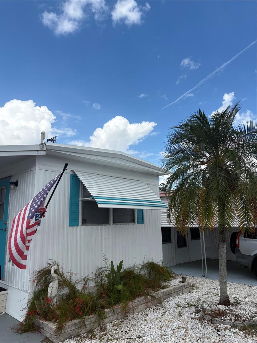 Whether it is seasonal living you desire or the full time Florida lifestyle, this is the mobile home for you!  This well-maintained home is being sold partially furnished and is truly turn-key.  The property features a 2-length carport which provides ample shelter for your vehicles plus additional shade for enjoying the outdoors.  At the back of the property, you'll find a laundry closet that adds to the home's functional layout with washer/dryer hook ups and a newer water heater.  Majestic Park is a vibrant, land owned 55+ community in the heart of Seminole. With a low $135 HOA monthly fee, you'll enjoy a well-maintained, active lifestyle without breaking the bank.  This home is just minutes from the Seminole City Center, giving you quick access to shopping, dining and entertaining.  And for those who prefer to be outdoors, the world-famous Gulf Beaches are only a short 10-minute drive away.