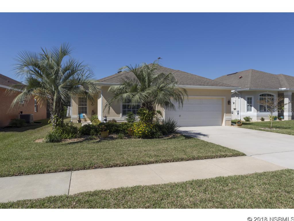 REDUCED $10K. This home is immaculate inside and out! Enjoy a newer home complete with a solar-heated saltwater pool across from the conservation area. You couldn't replace this home for this price! You'll love the vaulted ceilings and open floorplan of this 3BR/2BA, especially the updated kitchen and baths.  The kitchen is outfitted with new corian counters and tile backsplash. You'll enjoy the breeakfast nook looking out over the covered lanai and screen room. The bathrooms have been totally redone and include a jacuzzi tub and body jets in the showers. The master suite is complete with walk-in closet, double vanity, garden tub and separate shower. Both guest bedrooms have new wood laminte floors.  Relax in the large family room or enjoy formality in the separate dining room. You'll have peace of mind with hurricane resistant sliding glass doors with shutters for the windows. This home has been tastefully decorated with upscale fans, light fixtures and other fine finishes throughout. There's even an indoor laundry room connecting the home to the spacious garage. Attic includes a lighted storage area. Gas fire pit and cabana on back porch convey with sale.  MEASUREMENT ARE APPROXIMATE. ALL INFORMATION IS DEEMED RELIABLE BUT NOT GUARANTEED. BUYERS AND THEIR AGENTS TO VERIFY INFOMATION DEEMED IMPORTANT TO THEM.