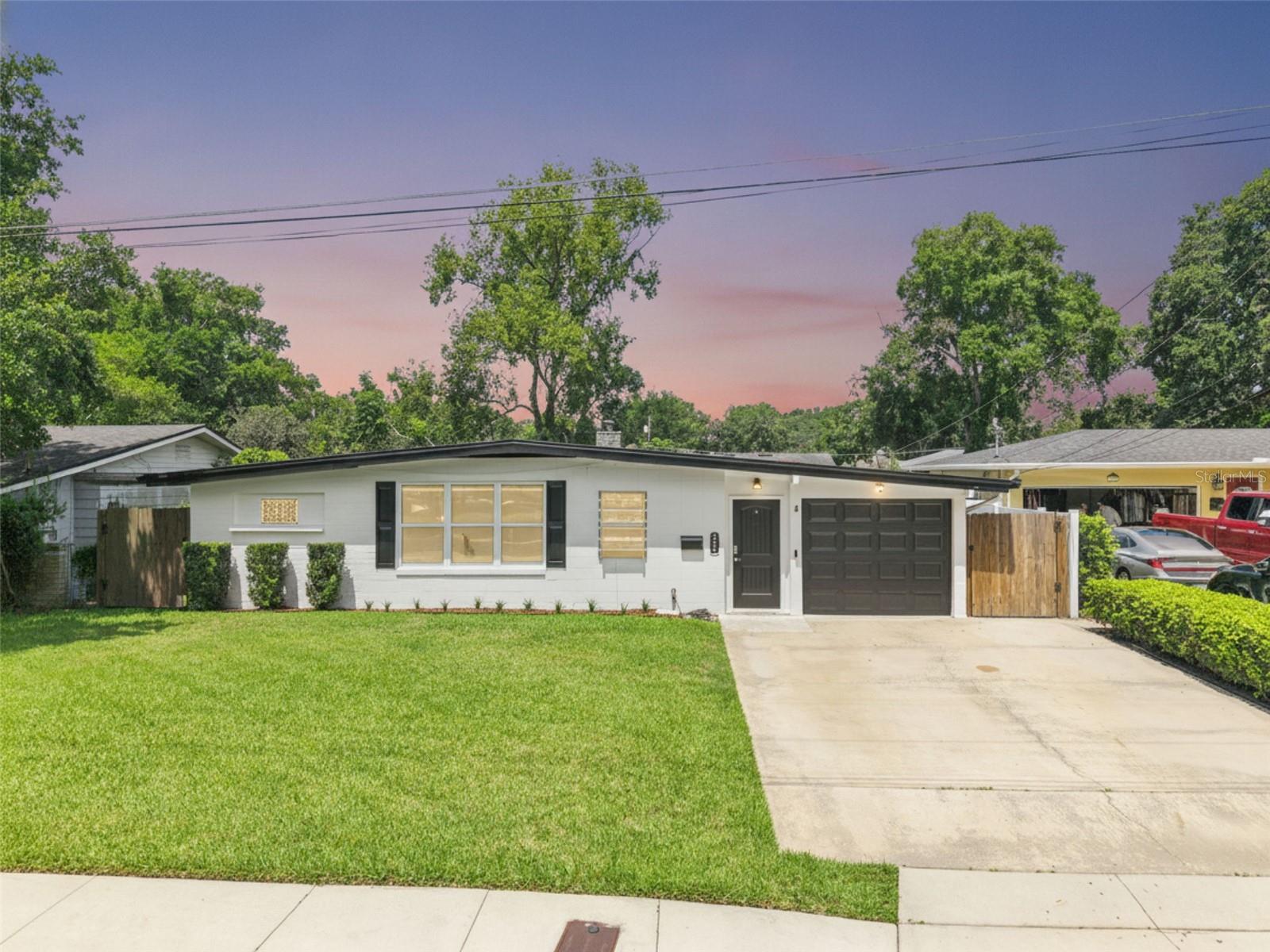 Ideally located in one of Orlando's most desirable neighborhoods, 526 N Hampton Ave places you just moments from downtown, the lively Milk
District, and scenic Dickson Azalea Park. Lake Eola is an easy walk away, while wonderful restaurants, shopping, and Colonial Plaza all sit within close reach. This move-in ready home marries an unbeatable location with smart, lasting improvements. Inside, 1,926 square feet unfold across an open floor plan that ties the kitchen, dining, and living areas into one welcoming space. Hard flooring runs
throughout, including luxury waterproof vinyl added in 2023 and hardwood floors from 2016. The kitchen, updated in 2016, anchors the home
and stands ready for everyday meals and easy entertaining. A generous playroom or family room offers space to spread out, relax, or work from home. Four bedrooms provide comfortable retreats, and two full bathrooms help mornings run smoothly. The primary suite bath was repiped in 2017 and the guest bath in 2015, adding welcome peace of mind. New windows brighten the interior, while two AC systems—a 3.5-ton main unit from 2019 and a brand-new mini split—keep every room cool throughout the year. The true magic waits out back, where a fenced yard becomes your private setting for hosting. A spacious paver patio invites weekend barbecues, festive gatherings, and lively dinners beneath the stars, while lush Saint Augustine grass, kept vibrant by a 3-zone smart irrigation system, creates a picture-perfect backdrop. A shed with electricity provides handy storage for entertaining essentials, and a Blink doorbell paired with security cameras lets you greet guests with confidence. Every detail here reflects thoughtful care and steady upgrades, from the flooring and windows to the plumbing and cooling systems. The result is a home that feels fresh, functional, and ready to enjoy from day one, with all the character of a well-loved central Orlando address. Move-in ready and beautifully maintained, this Orlando gem is built for gathering and made for memories. Schedule your private showing today!
