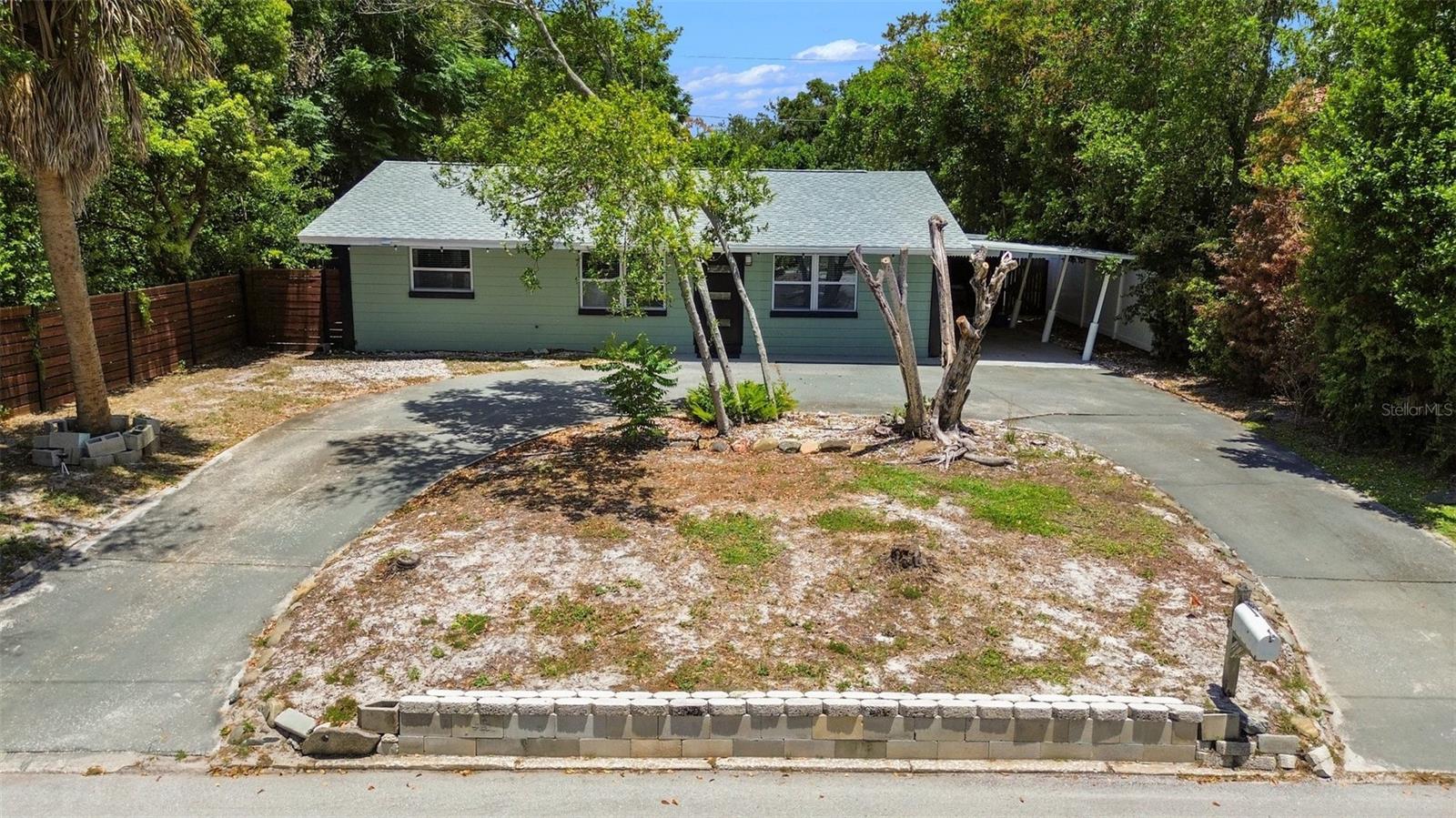 HIGH & DRY, UPDATED, AND JUST MINUTES FROM THE BEACHES and Pinellas Trail! Rarely do you find a property this close to the Gulf Coast offering approximately 25 feet of elevation, an oversized lot, and valuable updates already completed. Enjoy peace of mind with a newer roof, updated windows, remodeled kitchen and bathroom, upgraded electrical panel, natural gas service, and a tankless water heater, all while benefiting from a high-elevation location that helps set this home apart from many nearby coastal properties.

Situated on a spacious oversized homesite with no HOA, this property offers the flexibility and freedom today's buyers are searching for. The circular driveway provides abundant parking and welcoming curb appeal, while the expansive yard offers endless possibilities for a future pool, outdoor entertaining, gardening, play areas, pets, or simply enjoying your own private outdoor space.

Inside, you'll find a comfortable and inviting floor plan designed for everyday living and family gatherings. The combination of thoughtful upgrades and solid construction allows buyers to move in and immediately begin enjoying the Florida lifestyle without the expense of major system improvements.

Location is truly exceptional. Enjoy quick access to award-winning Gulf beaches including St. Pete Beach, Treasure Island, Madeira Beach, and Pass-a-Grille while returning home to a higher-elevation neighborhood. Spend weekends enjoying boating, waterfront dining, fishing, and world-famous sunsets just minutes from your front door.

Outdoor enthusiasts will love being less than half a mile from the Pinellas Trail, one of Florida's most popular recreational trails. Stretching nearly 50 miles through Pinellas County, the trail offers miles of paved pathways for biking, jogging, walking, rollerblading, and enjoying the outdoors while connecting residents to parks, waterfront areas, restaurants, shopping districts, and local communities throughout the county. It's an incredible amenity for active families, fitness enthusiasts, and anyone looking to enjoy a healthier lifestyle close to home.

The property is also conveniently located near the vibrant downtown district of Gulfport, known for its waterfront charm, local restaurants, art galleries, boutique shopping, community events, and festivals throughout the year. Nearby Stetson University College of Law adds additional appeal, while downtown St. Petersburg, parks, schools, recreation, and everyday conveniences are all within easy reach.

Whether you're searching for a move-in-ready family home, a property with room to grow, or a home near the beaches that offers both convenience and peace of mind, this exceptional St. Petersburg property delivers. Oversized lot, high elevation, no HOA, major updates, proximity to the Pinellas Trail, and an unbeatable location near Gulfport and the Gulf beaches make this a rare opportunity in today's market.
