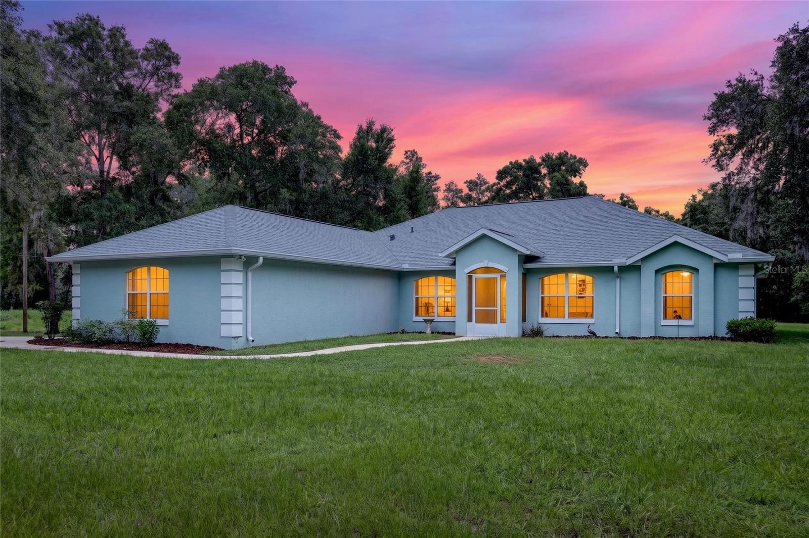 Welcome to Rolling Ranch Estates — where nearly 5 acres of peaceful Florida landscape meets an unbeatable central location. Tucked between Dunnellon, Ocala, and the Crystal River area, this property puts you minutes from the Rainbow River, Juliette Falls Golf Club, local dining and shopping, and endless outdoor recreation — all while enjoying the privacy and space that acreage living provides.

Custom built in 2002 and freshly updated inside and out, this move-in ready 3-bedroom, 2-bath, 3-car garage split plan home has been thoughtfully refreshed and is ready for its next chapter. A brand new roof in 2026 — including new soffits, gutters, and downspouts — gives buyers immediate peace of mind on the biggest ticket item, and comes with a five-year wind mitigation certificate.

Inside, the open kitchen flows naturally into the main living area, which opens to a Florida room — a perfect spot for morning coffee or evening relaxing whatever the season. The primary suite is generously sized and features a garden tub, separate shower, and dual vanities. The split plan offers 2 nice sized bedrooms and another full bath on other side of home.  And there's also a Bonus/Flex room with double pocket doors that can be used as an office, library, playroom, den or whatever you need! The dedicated laundry room includes a utility sink for added convenience.

Step outside and enjoy the freedom that nearly 5 acres affords. The property includes a pump house that supplies water to the home and utilizes a saltwater conditioning system. Two storage units keep everything organized, and a kayak is  included so you can head straight to the river. The concrete patio provides a great outdoor gathering space, with plenty of room beyond to make this property your own.

Privacy, space, a new roof, and a location that gives you access to the very best of Central Florida — this one is a rare find. Come see it!